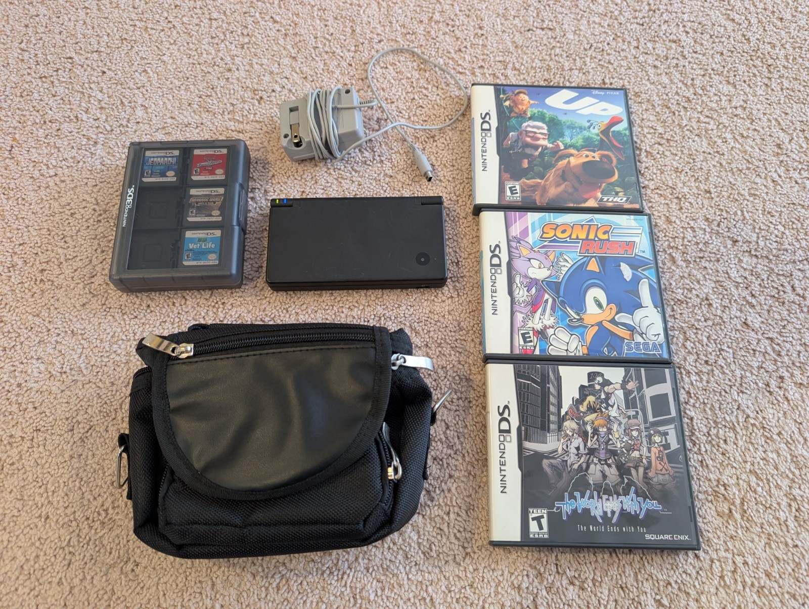 Nintendo DSI console black w/charger, carrying case & games (Mario, Sonic, etc)