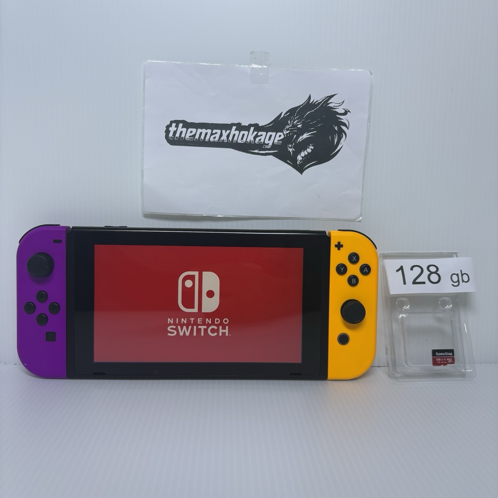 Nintendo Switch Console + 128gb MicroSD Extra Storage | Orange & Purple Joycons