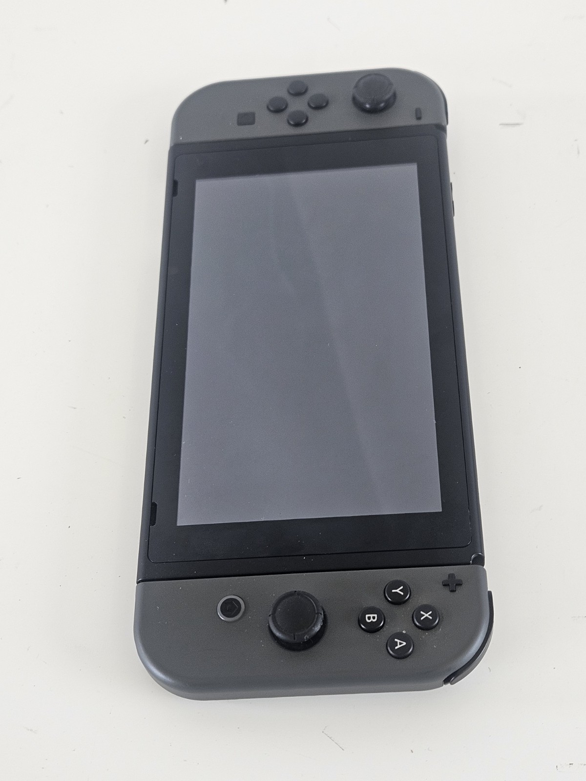 NINTENDO SWITCH HANDHELD – HAC-001 + OEM Charger – Tested