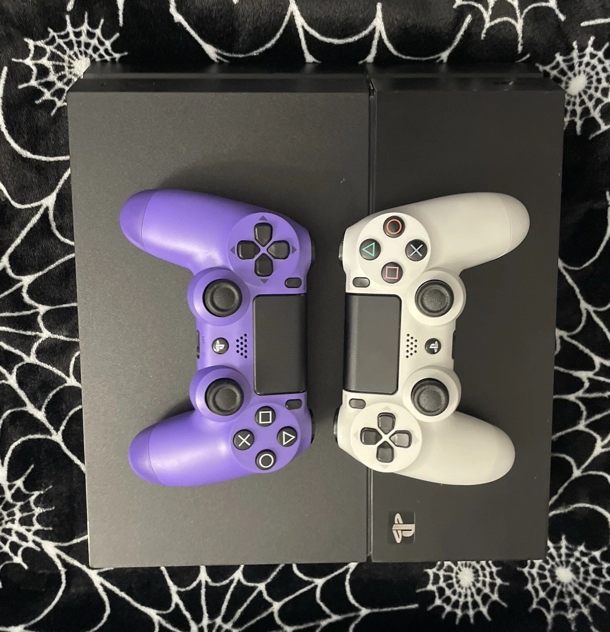 Sony PlayStation Black PS4 and White and Purple Wireless Controllers Bundle