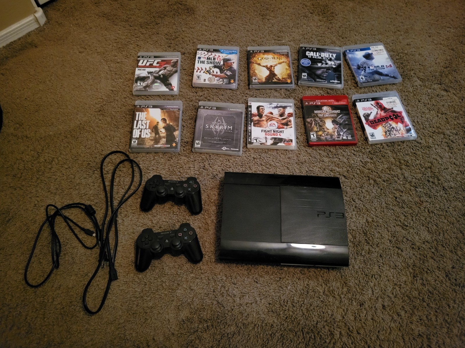 Sony PlayStation 3 Console with 2 Controllers, and 10 games (No HDMI Cable)