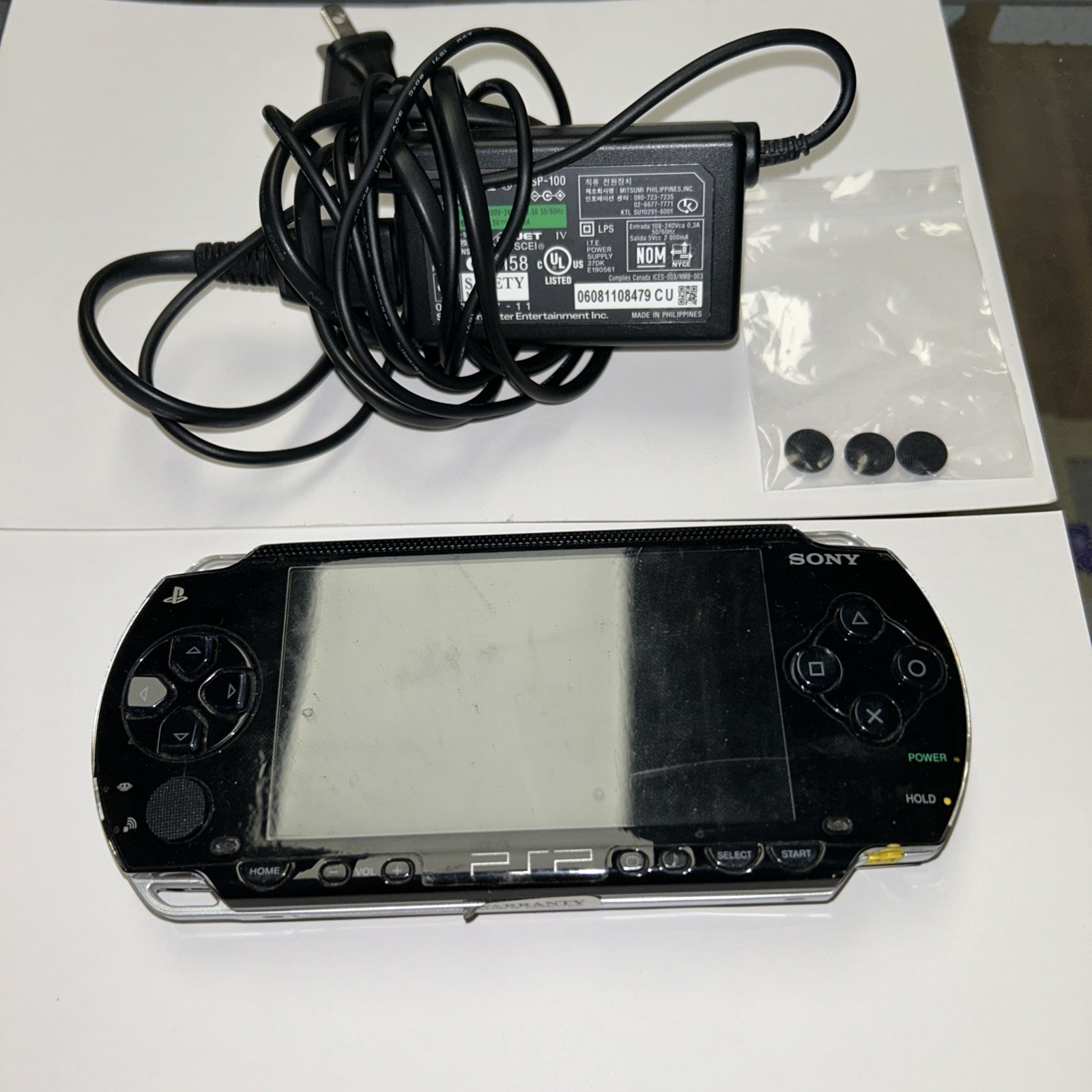 SONY PSP 1000. Works. Cable Plus Extra Joystick Caps.