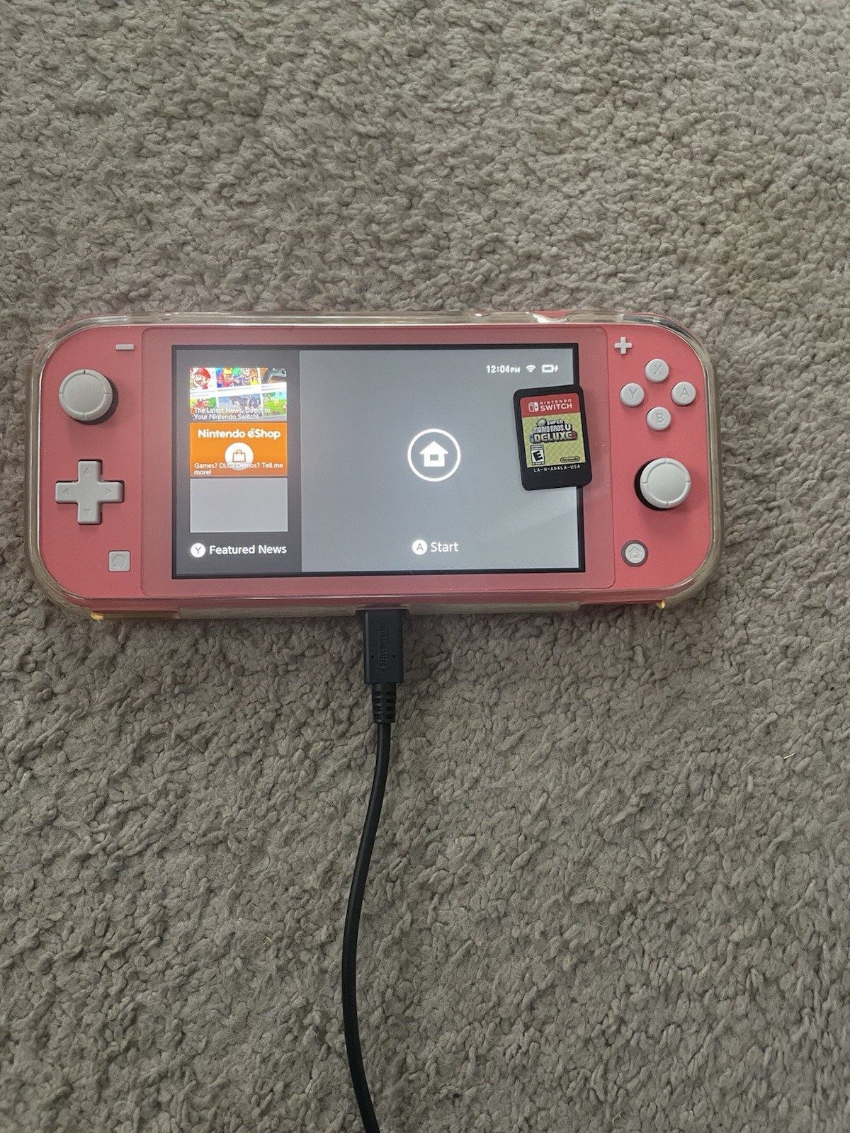 Coral Nintendo Switch Lite. Case, game and charger included.
