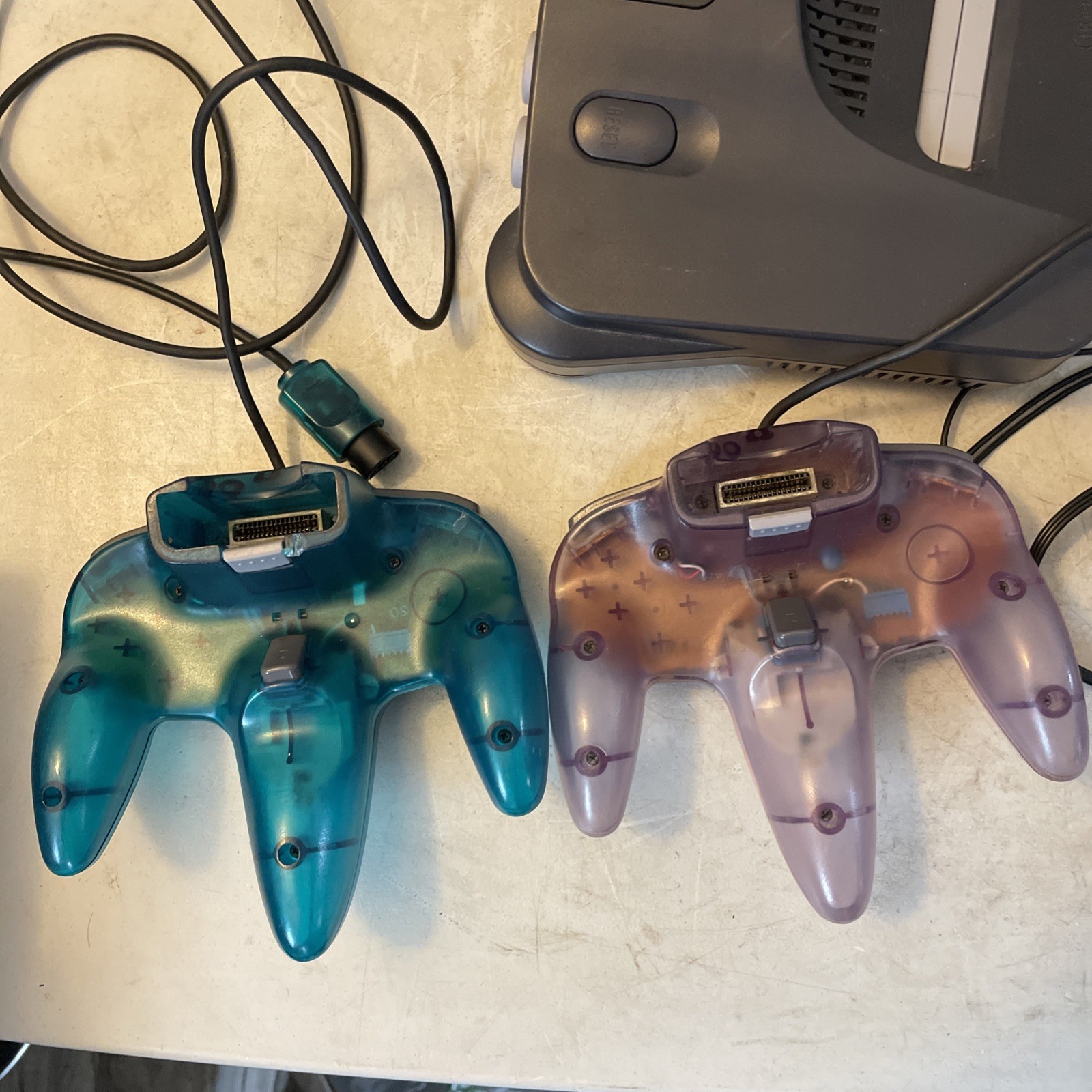 Nintendo 64 Console Bundle | Original W/ Ice Blue & Atomic Purple Controllers