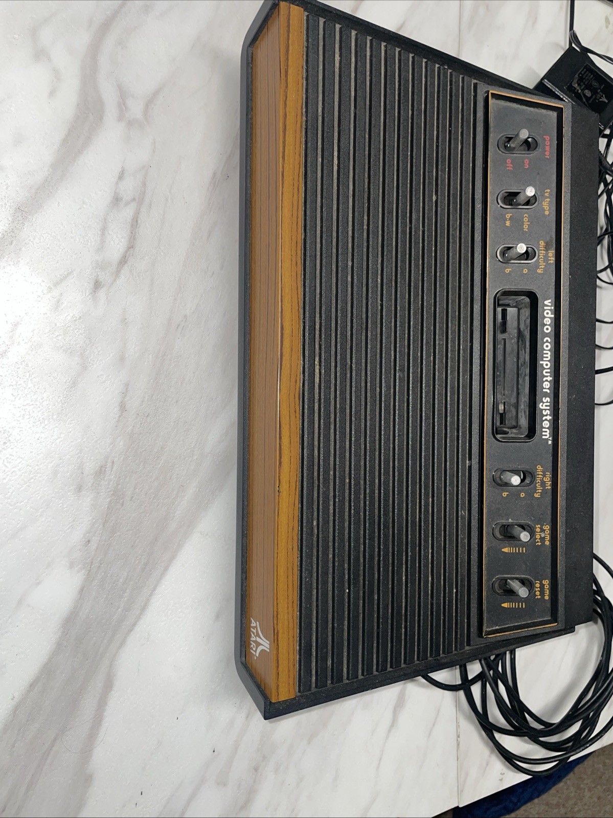 Atari 2600 Bundle with Console, 4 Games, Joystick, Paddles and Coax Adapter.