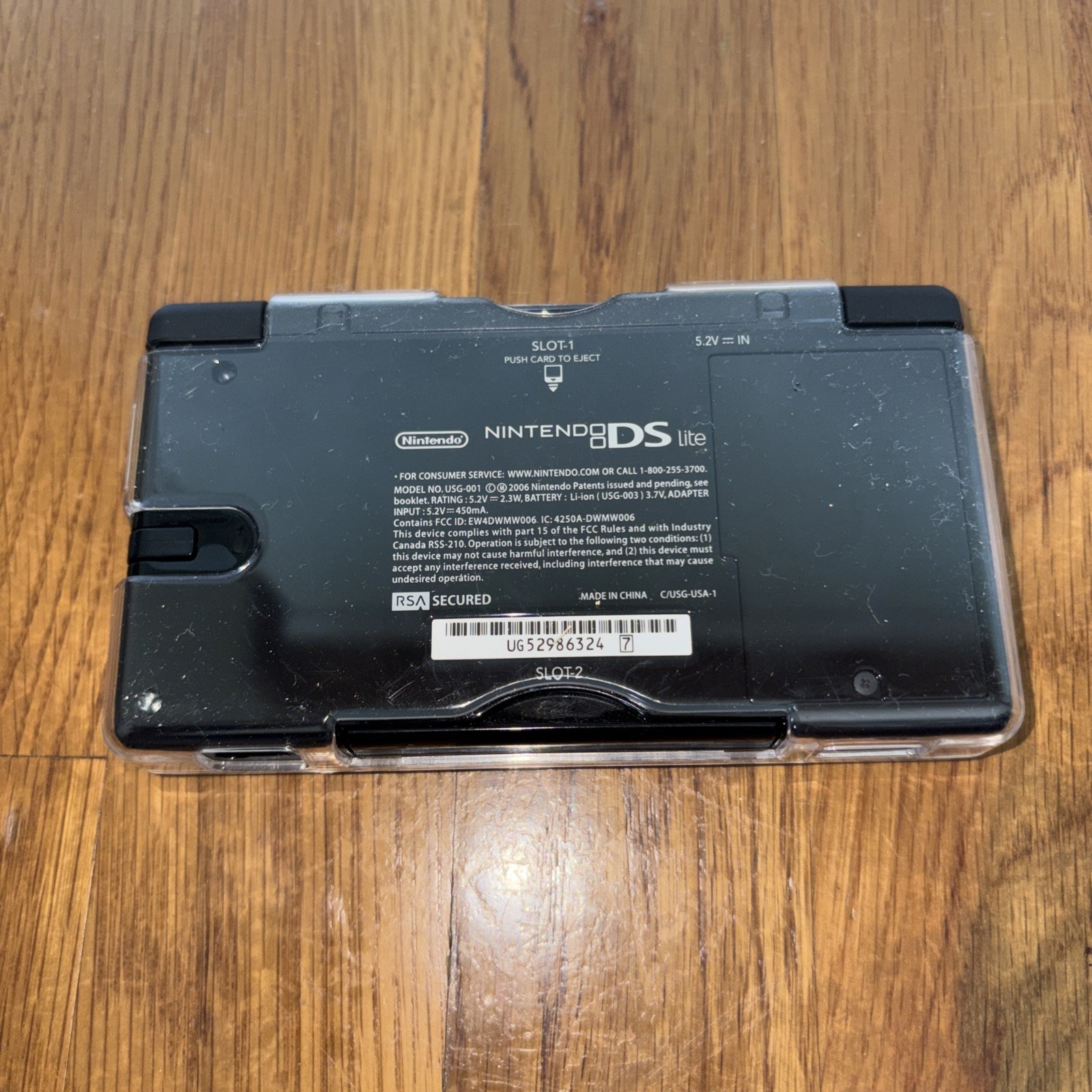 Nintendo DS Lite Console Black with charger case and four games model USG-001