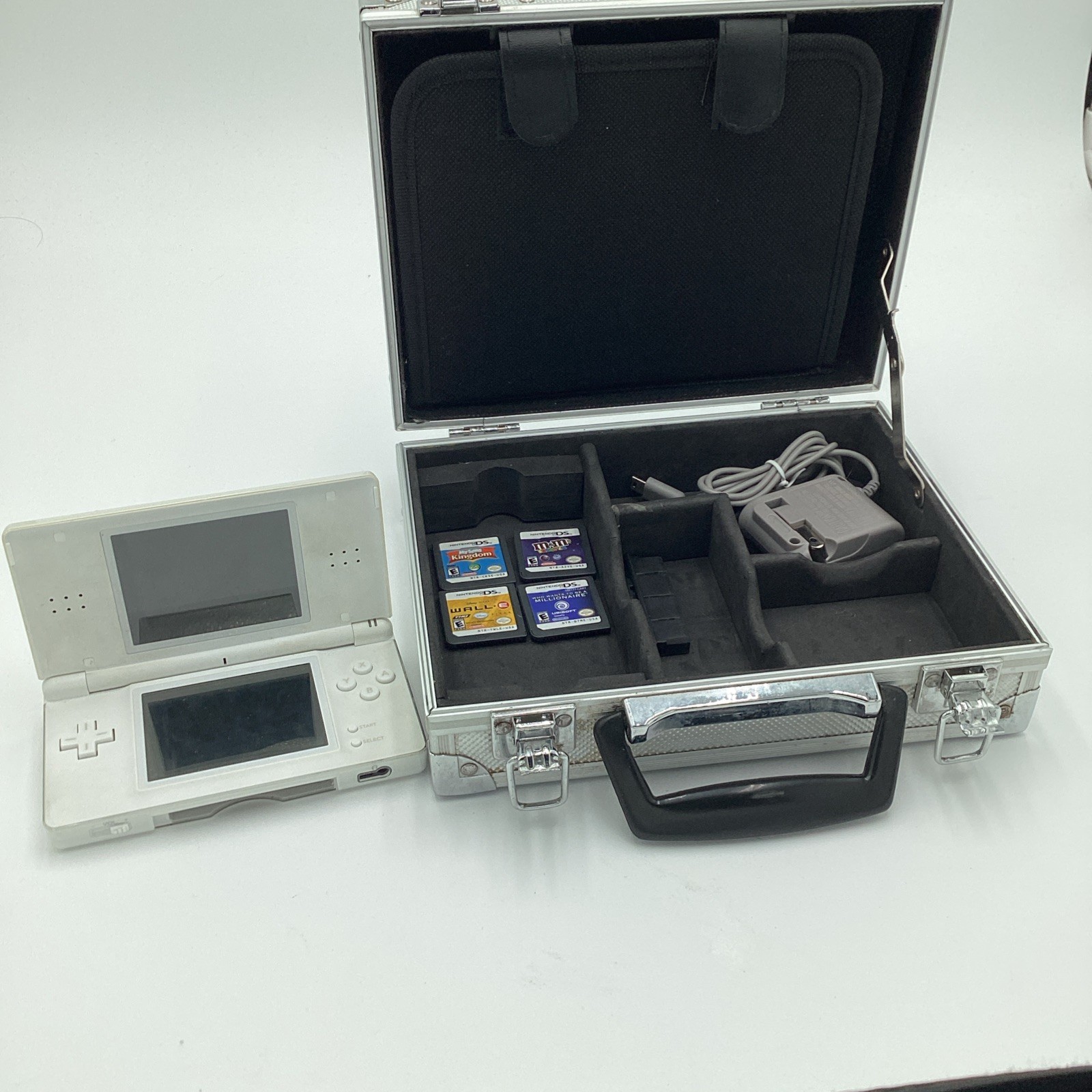 Nintendo DS Lite Lot Complete With Four Games, Charger, Stylus And A Metal Case