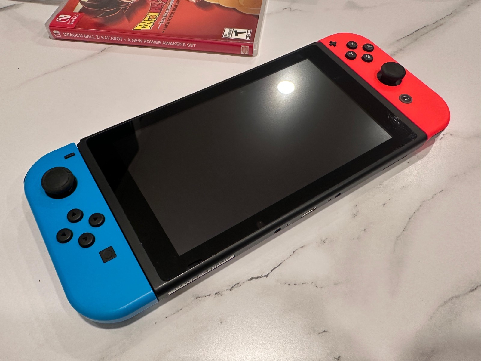 Nintendo Switch 32GB Black Console with Neon Red and Neon Blue Joy-Con