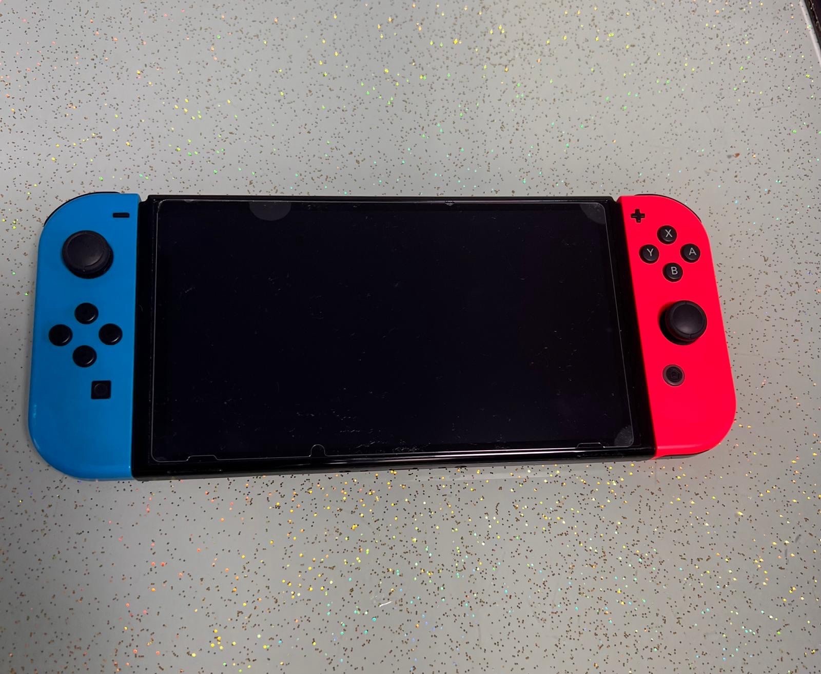 Nintendo Switch V1 Console with Joy-Con Grip Travel Case, Charger Fortnight Fifa