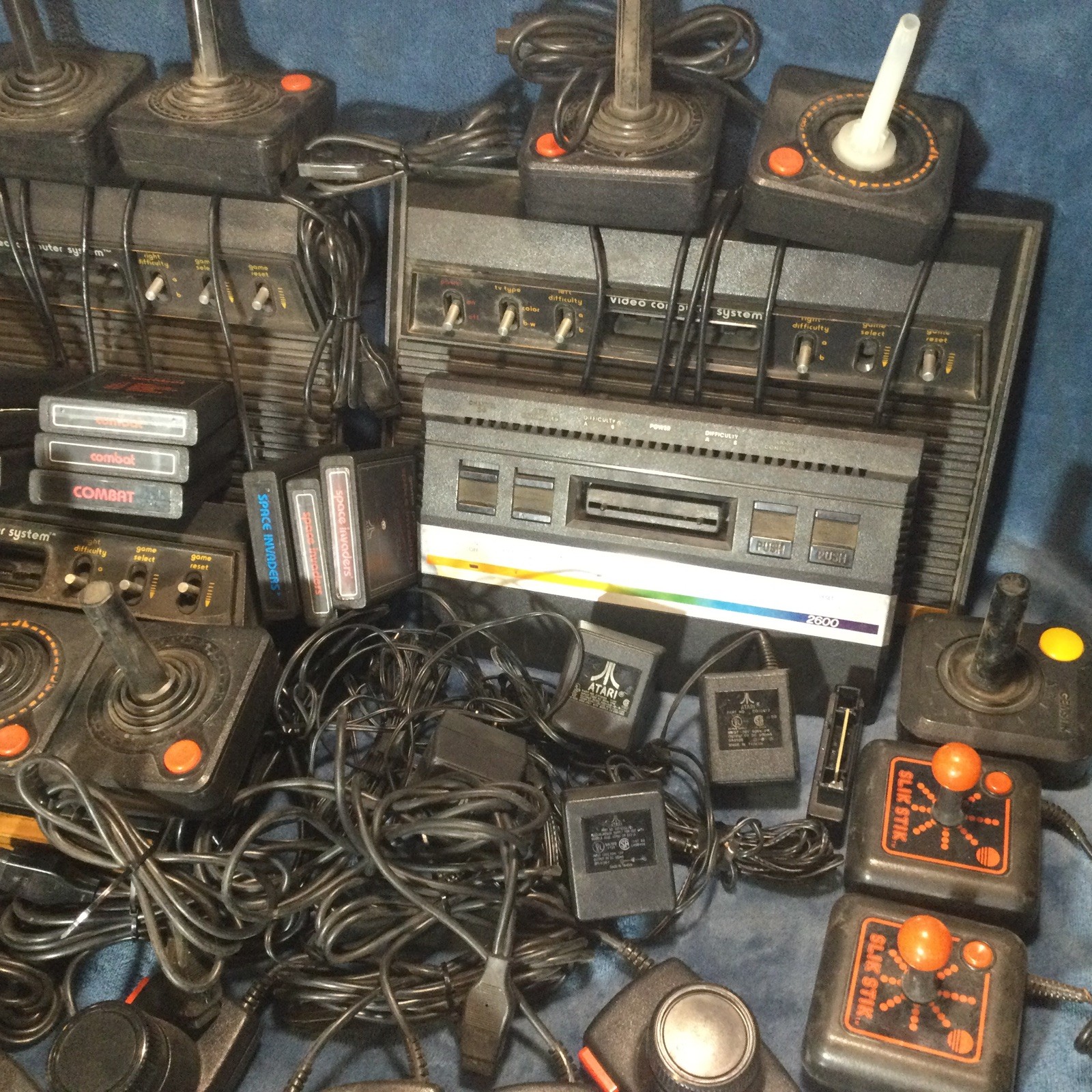 LOT(4) ATARI 2600 CONSOLES (42)GAMES (21)CONTROLLERS (4)AC ADAPTERS UNTESTED!!