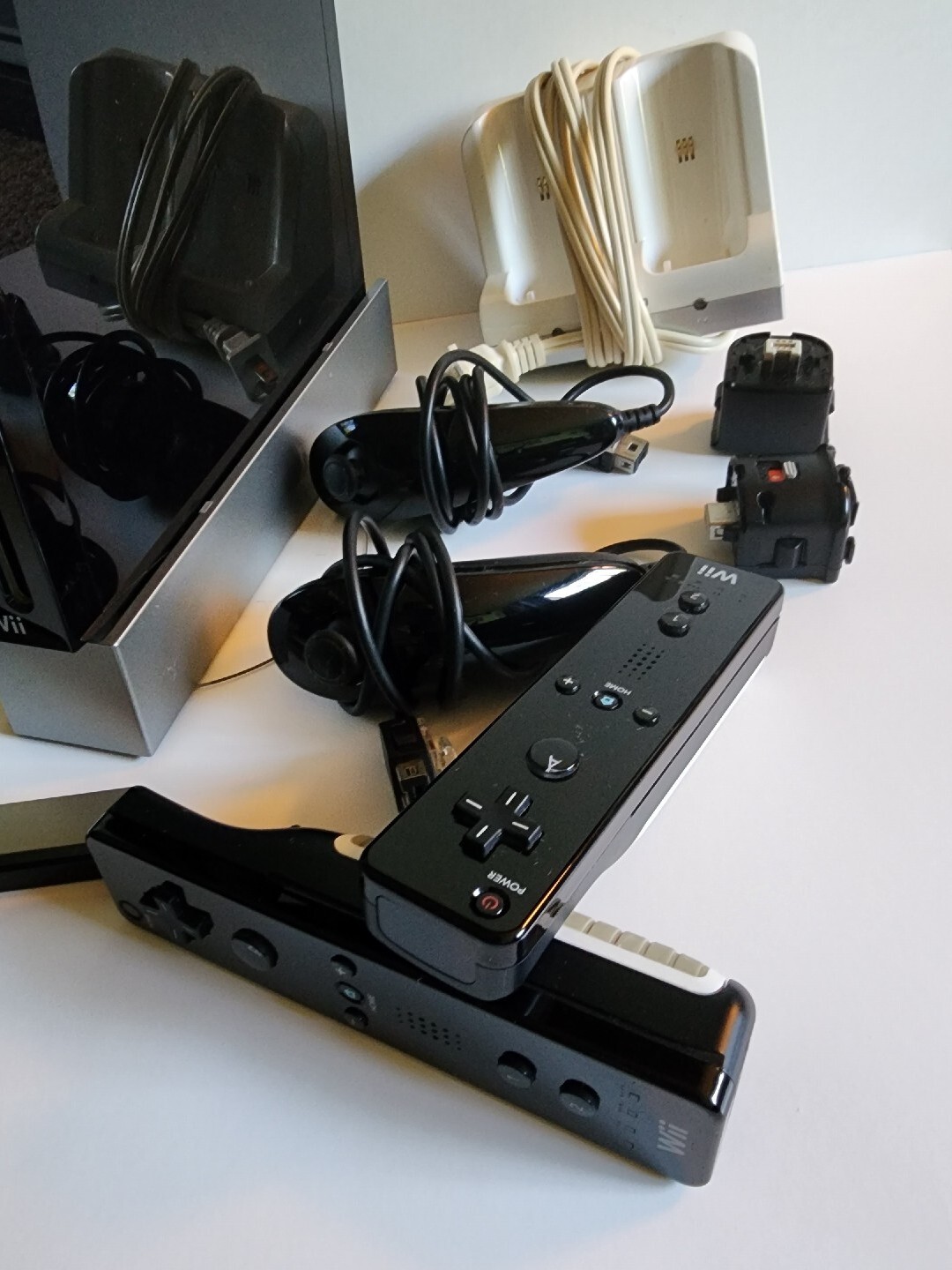 Nintendo Wii Black, 2 Wii Remote Plus, Charger Base With Assorted Games As Seen