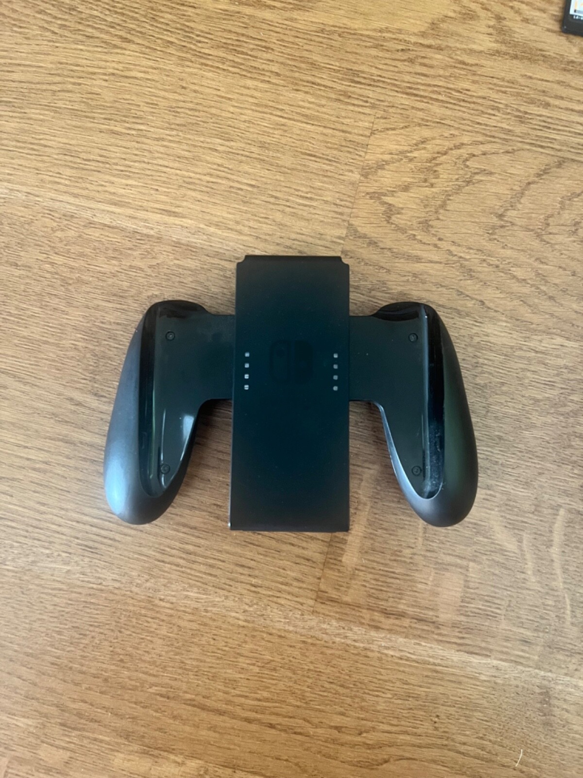 Nintendo Switch with Super Smash Bros and accesories.