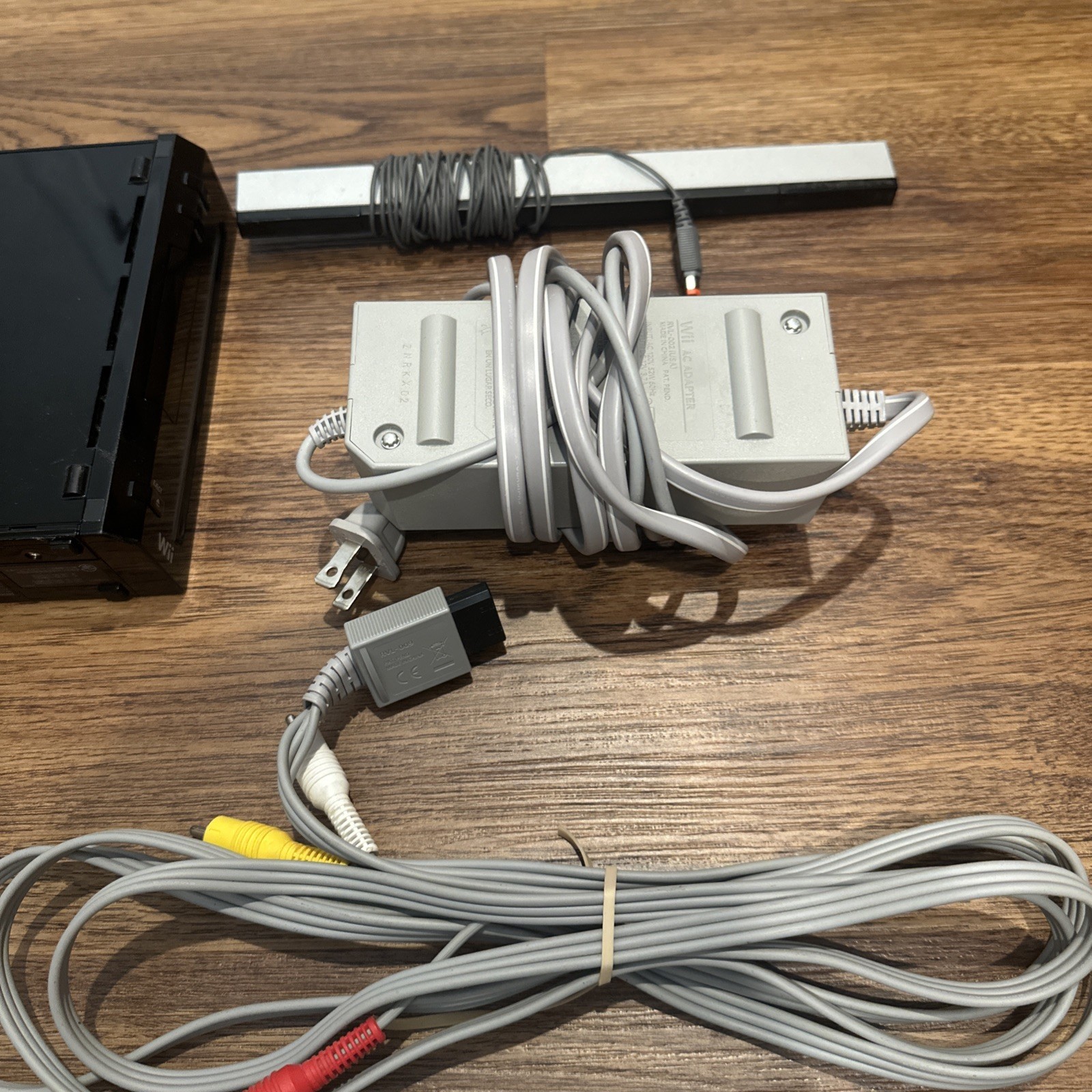 Nintendo Wii Video Game BLACK CONSOLE, 2 REMOTES, WHEEL + ACCESSORIES