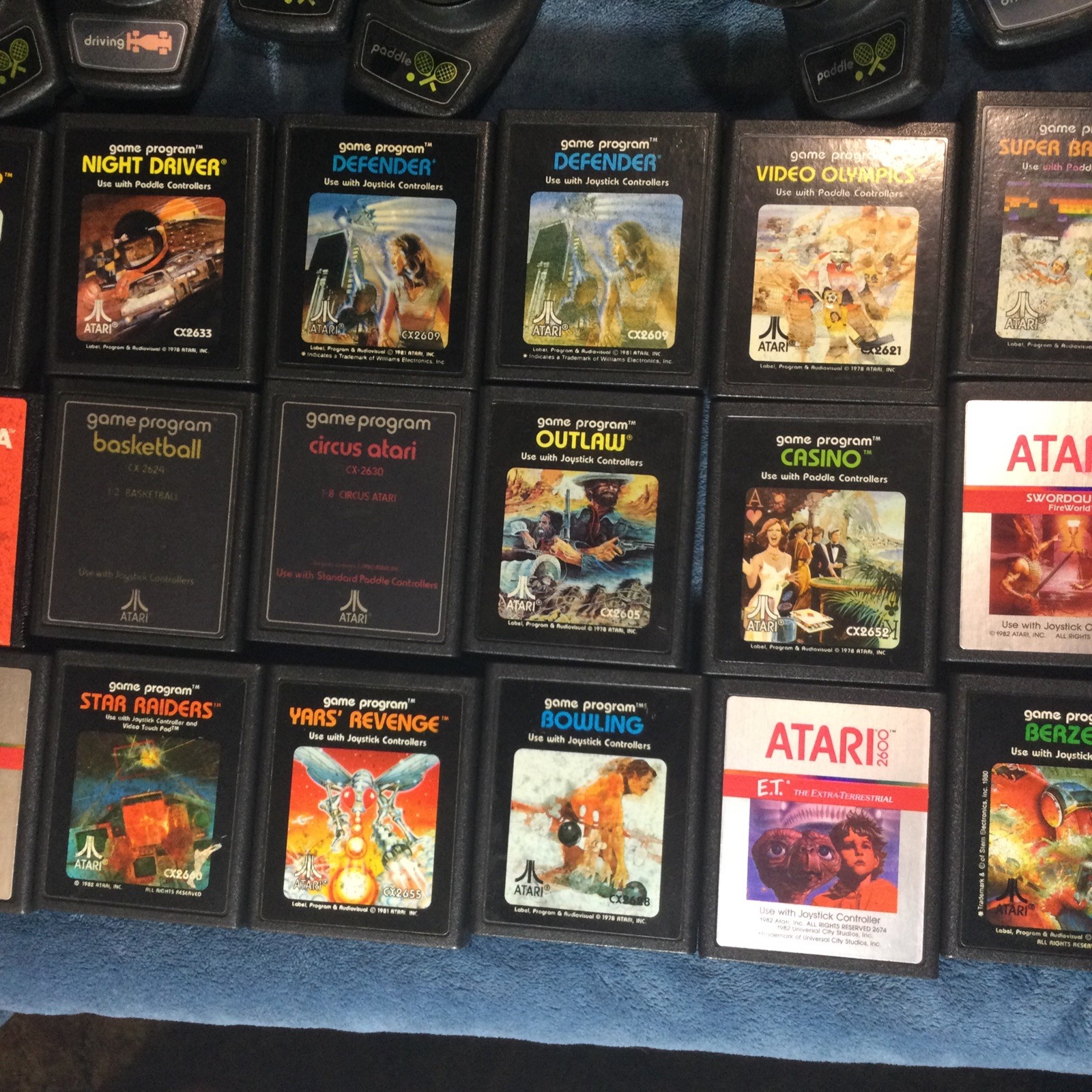 LOT(4) ATARI 2600 CONSOLES (42)GAMES (21)CONTROLLERS (4)AC ADAPTERS UNTESTED!!