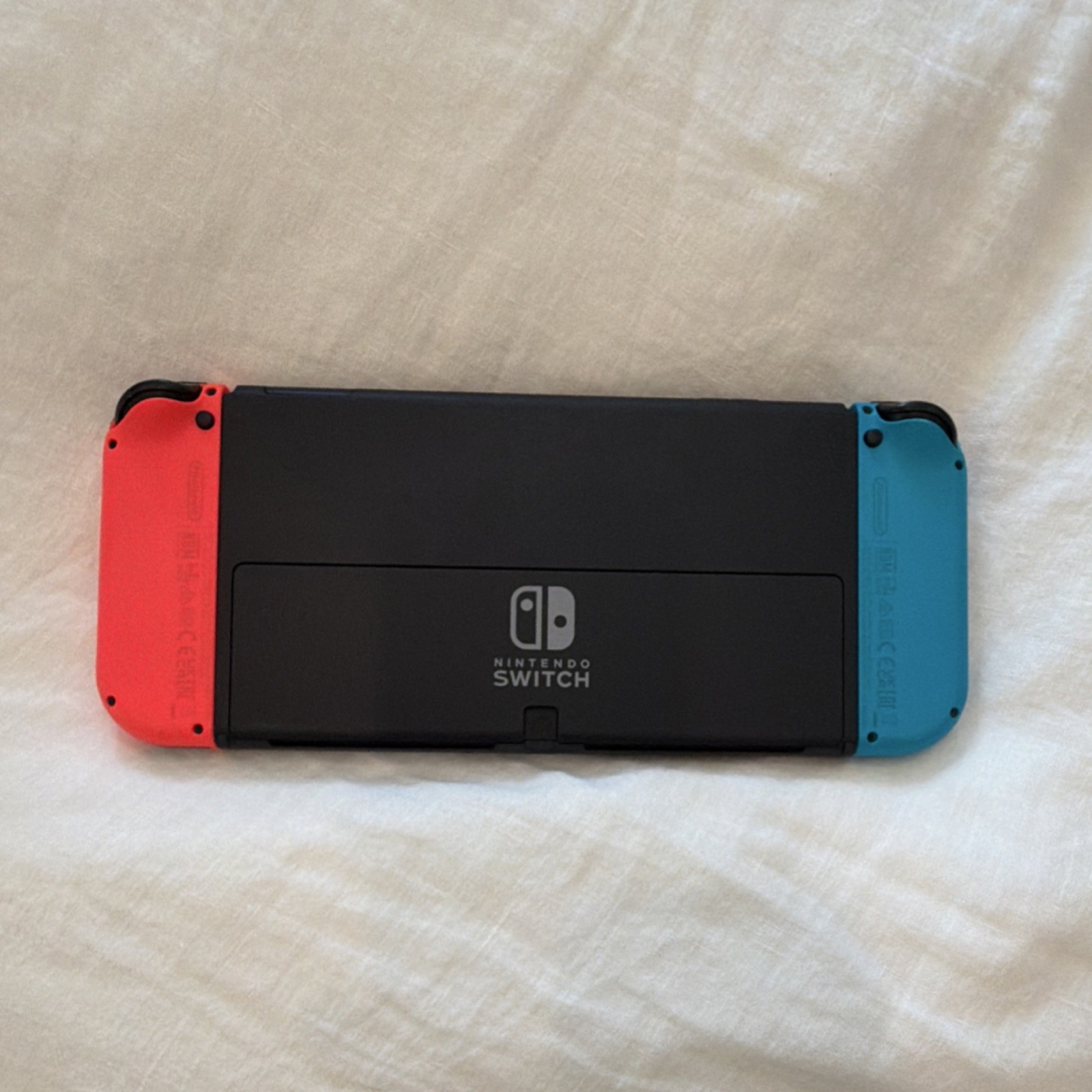 Nintendo Switch Oled In Black With Red And Blue Joy-Con