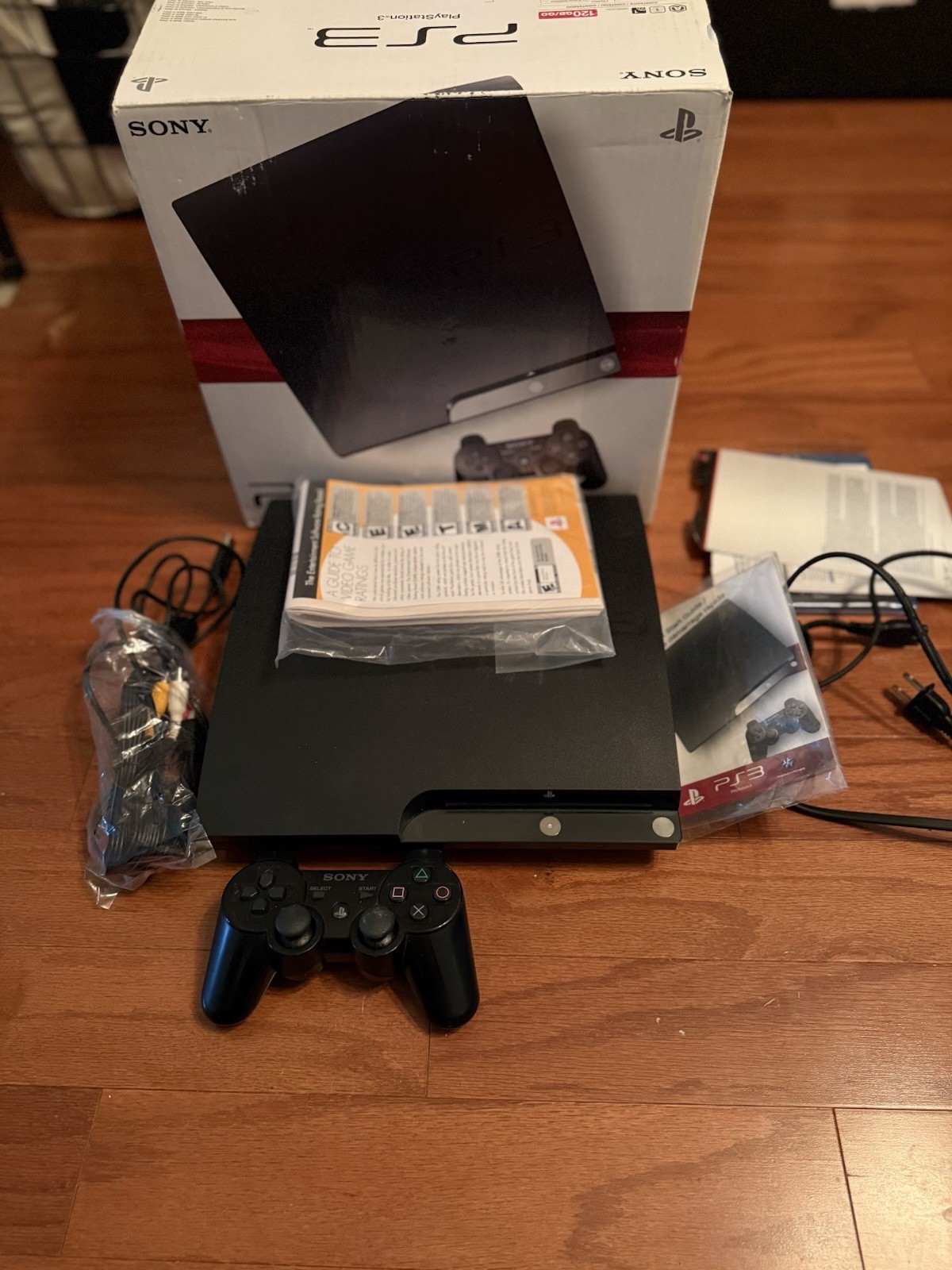 Sony Playstation 3 Slim Console (COMPLETE IN BOX, EXCELLENT CONDITION) W games