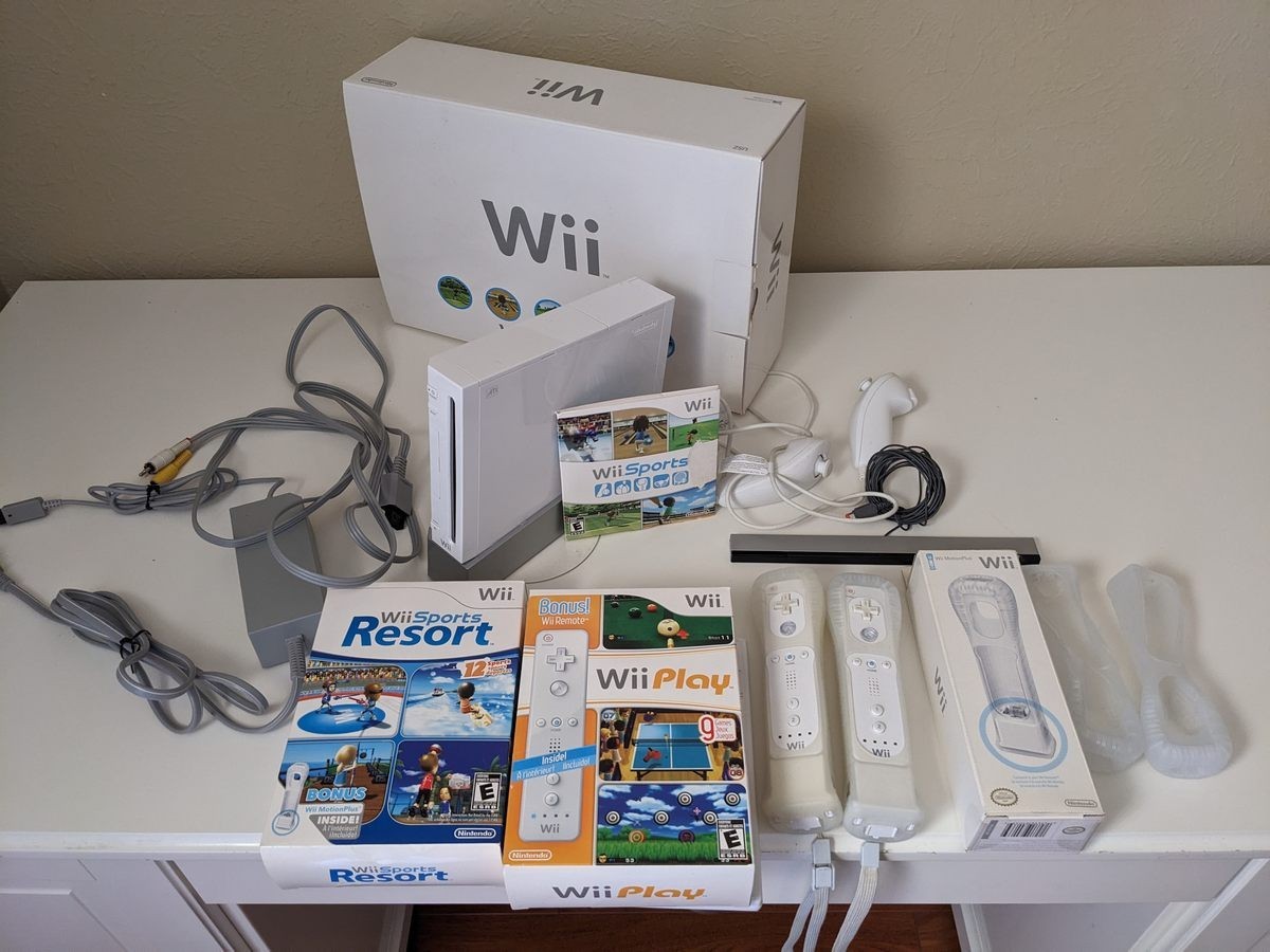 Wii RVL-001 Bundle With Sports Resort, Sports, Play, 2 Motion Plus Controllers
