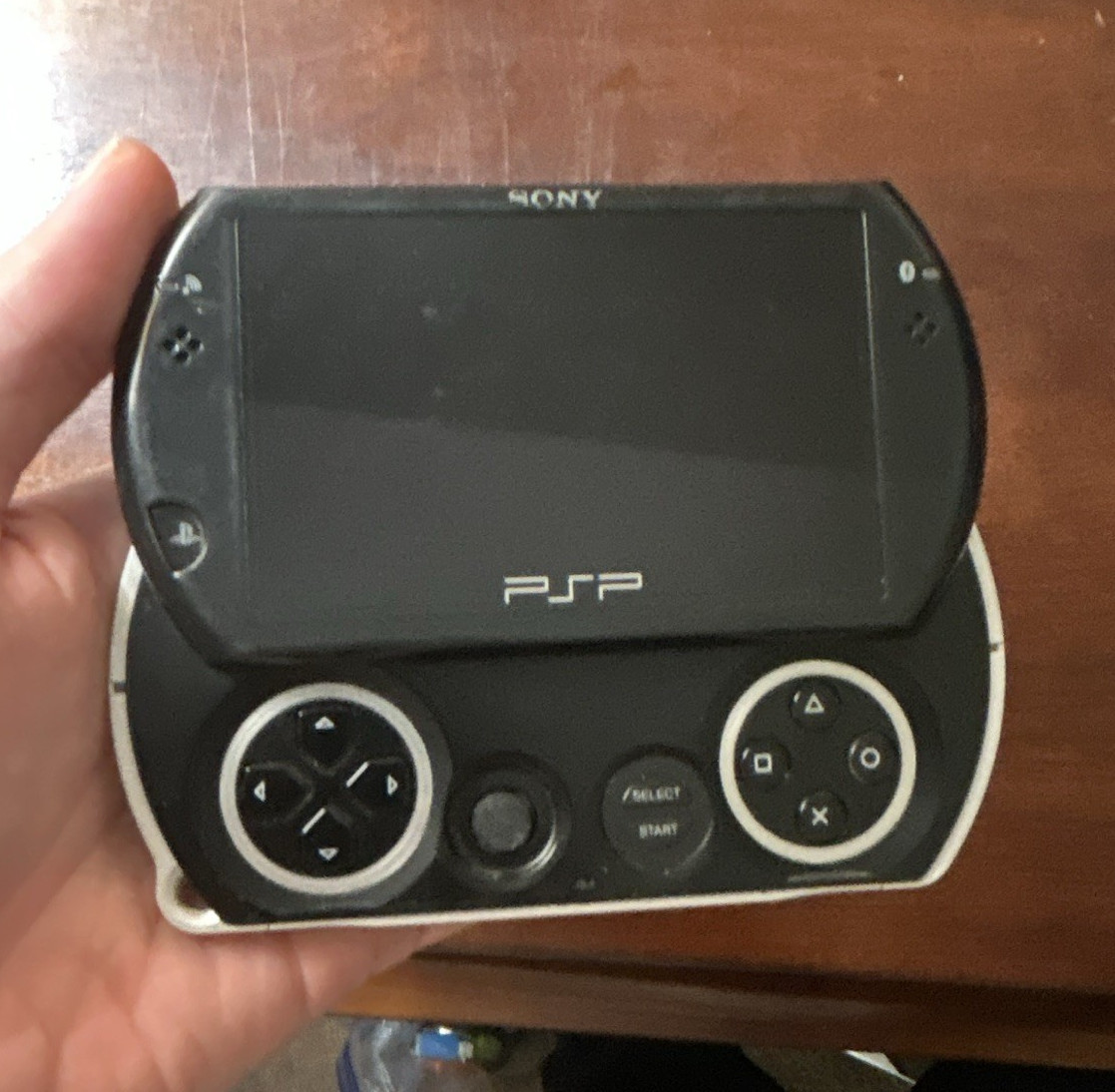 Sony PSP Go Black/Silver (PSP-N1001) w/ USB Cable (5 PSP games of your choice)