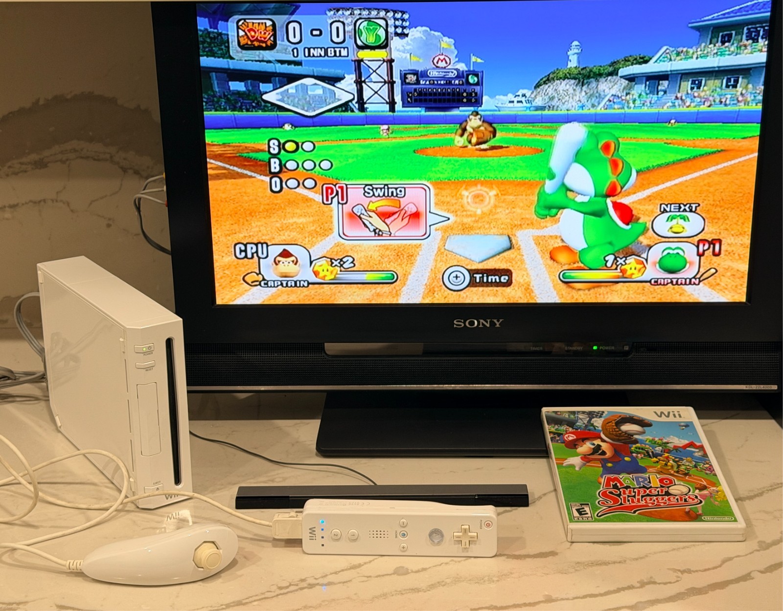 Nintendo Wii Console with Wii Remote, Nunchuck, Wires, Super Mario Sluggers Game