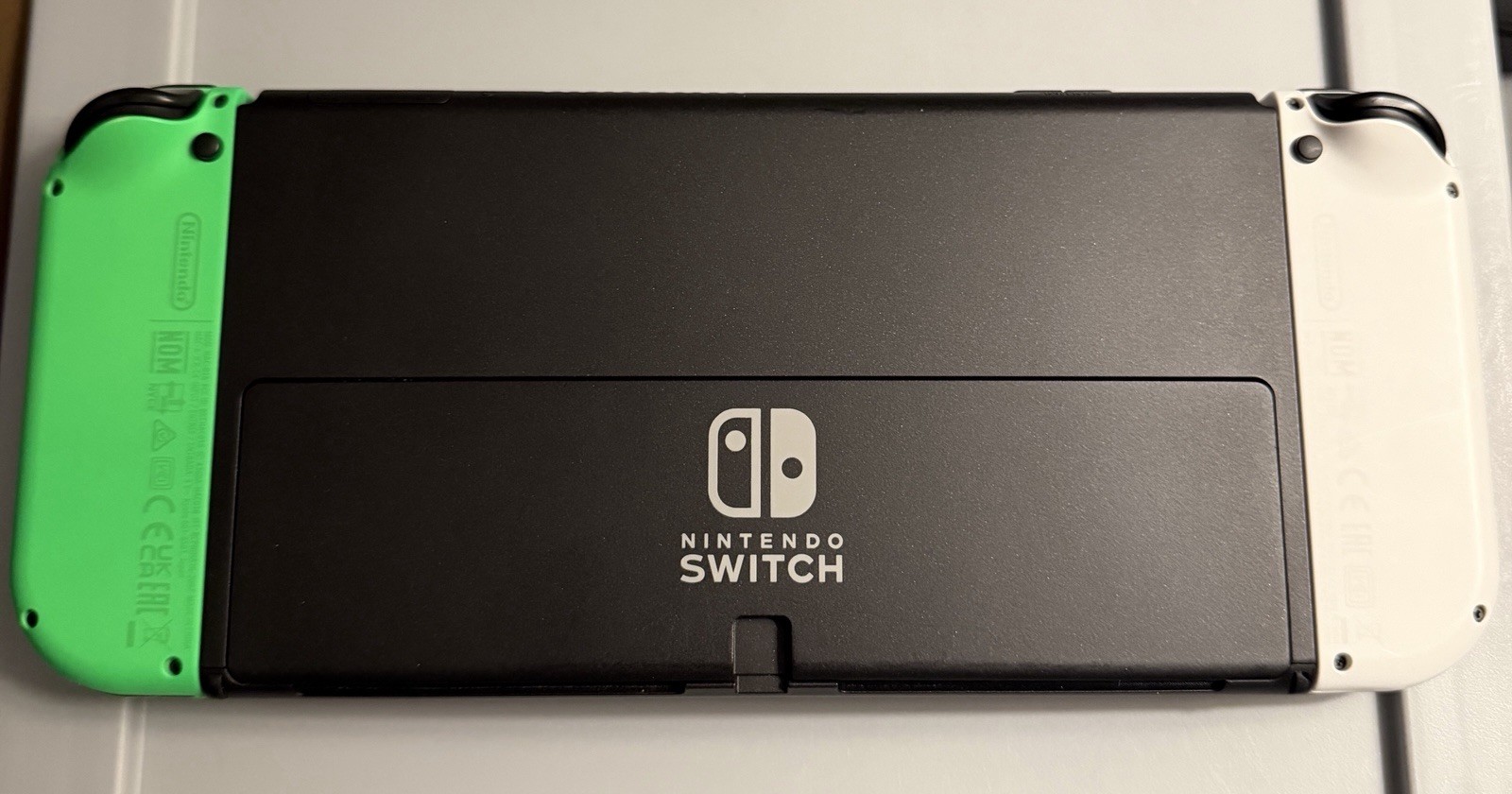 Nintendo Switch (OLED) Console White/Green Joy-Con w/ Dock, Grip