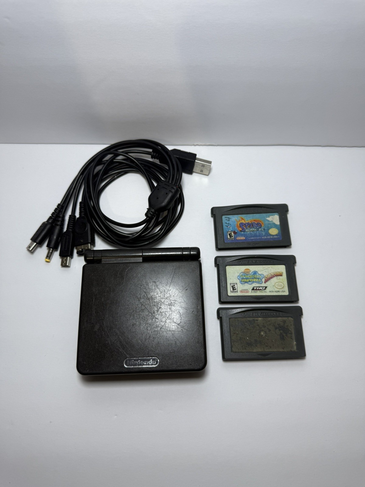 Nintendo Game Boy Advance SP Handheld Console Onyx Black With Games and charger.