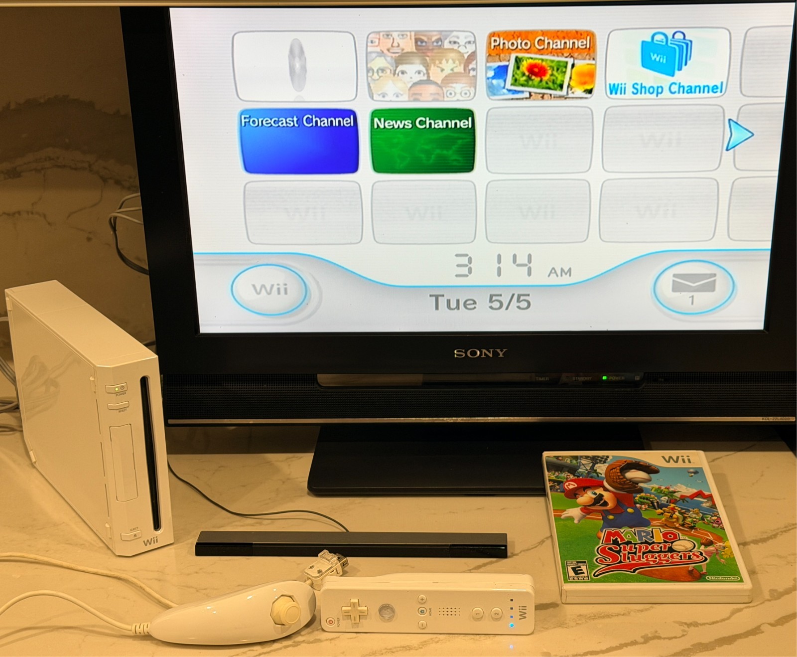 Nintendo Wii Console with Wii Remote, Nunchuck, Wires, Super Mario Sluggers Game