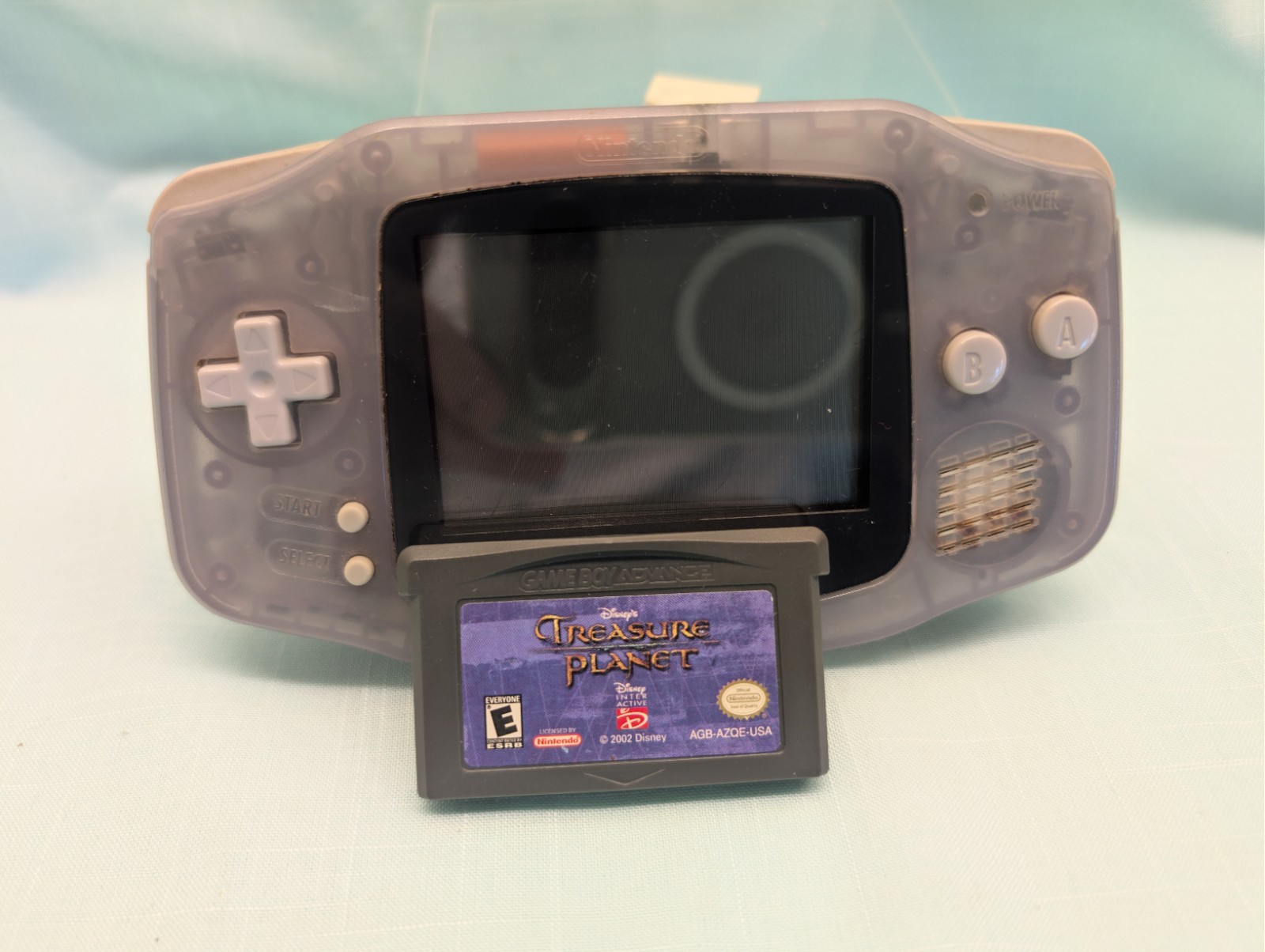Nintendo Game Boy Advance Handheld System Clear/Gray w/ Disney’s Treasure Planet