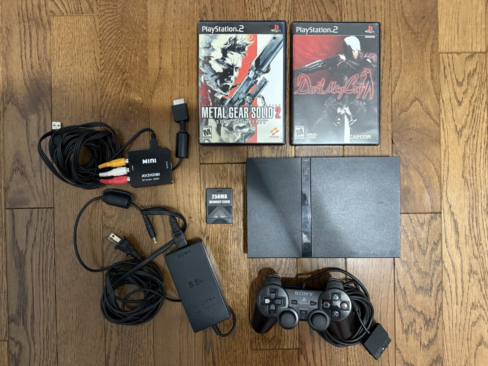 working sony ps2 console with cords, memory card, controller, 2 working games