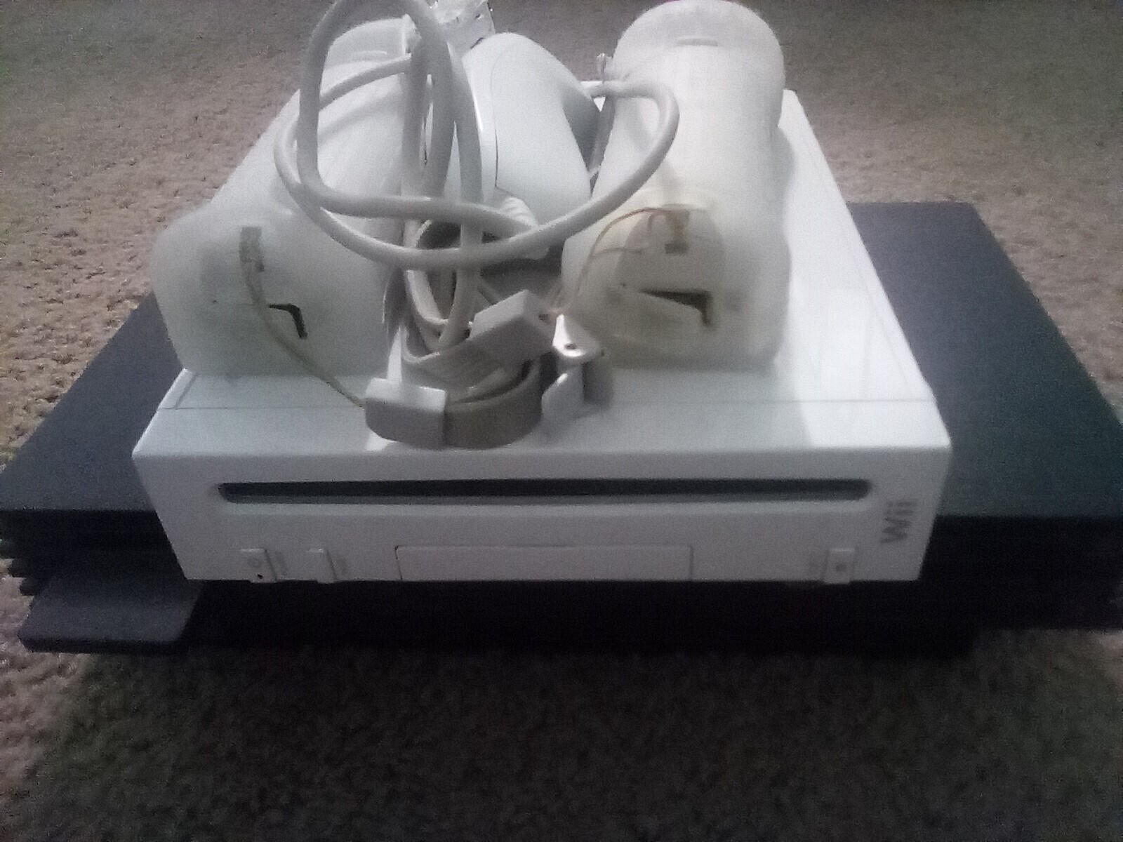 Sony PlayStation 2 Console – Black (SCPH-39001) and Wii white box. 