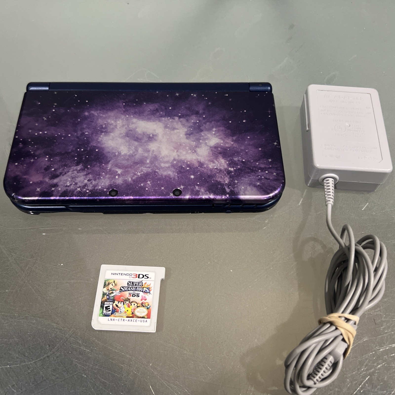 Nintendo 3DS XL Galaxy Edition Handheld Console System Purple & Super Smash Bros