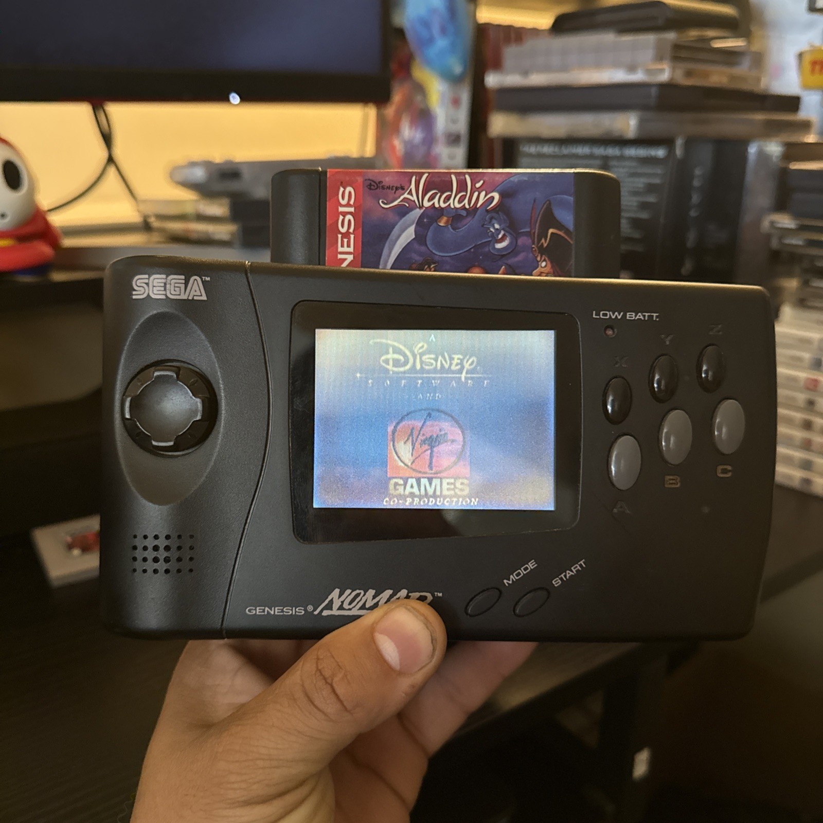 Sega Nomad console with Battery Pack With Aladdin Game
