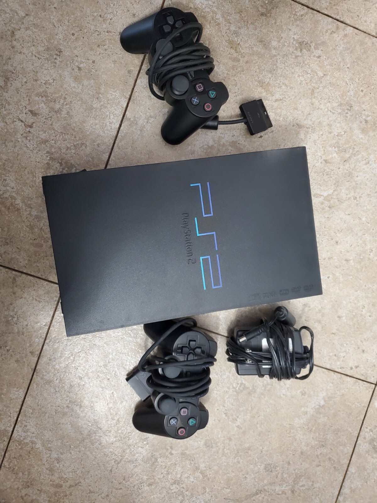 Sony PlayStation Black Console, With 2 Controllers, Wheel, Pedal and Games.