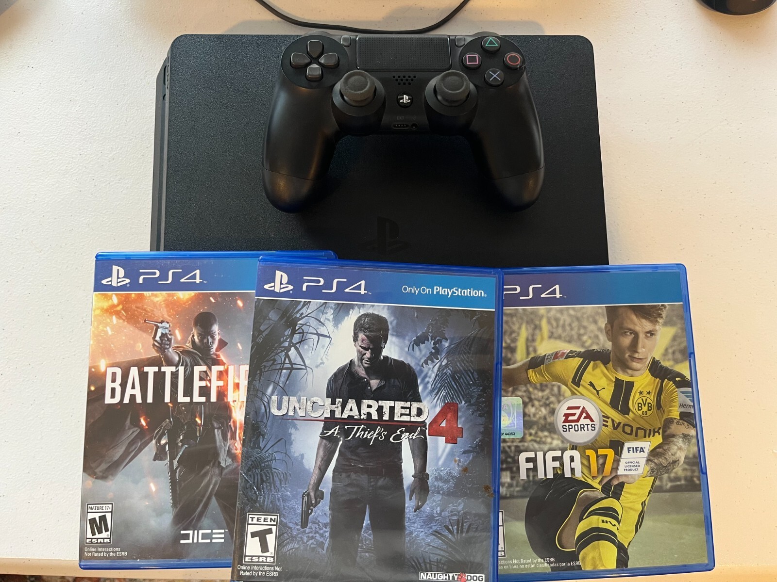 Sony PlayStation 4 Slim 500GB Console – Black with Controller and Games 
