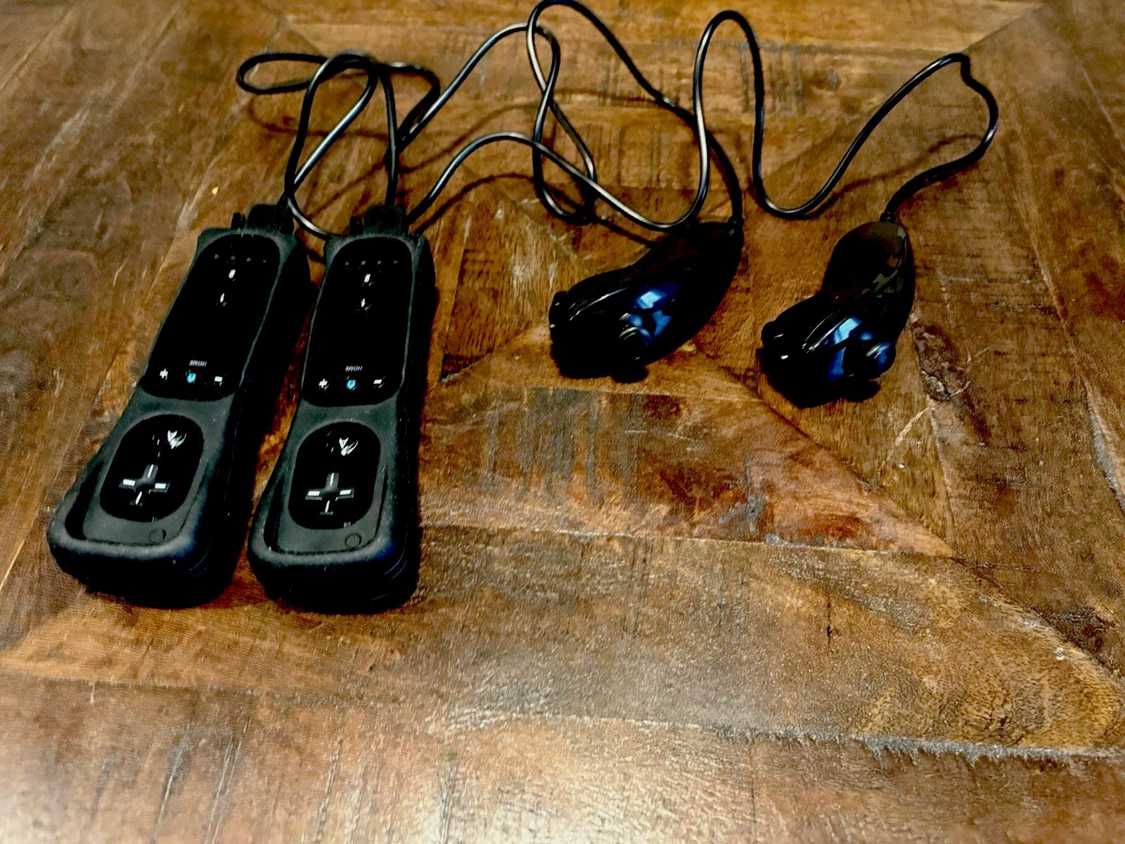 Nintendo Wii Black Console, 2 Controls, 2 Nun Chucks, 2 motion plus add ons.