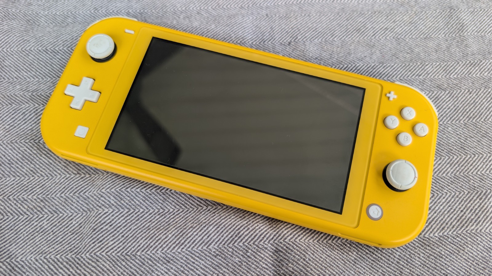 Broken Nintendo Switch Lite Yellow Handheld Console