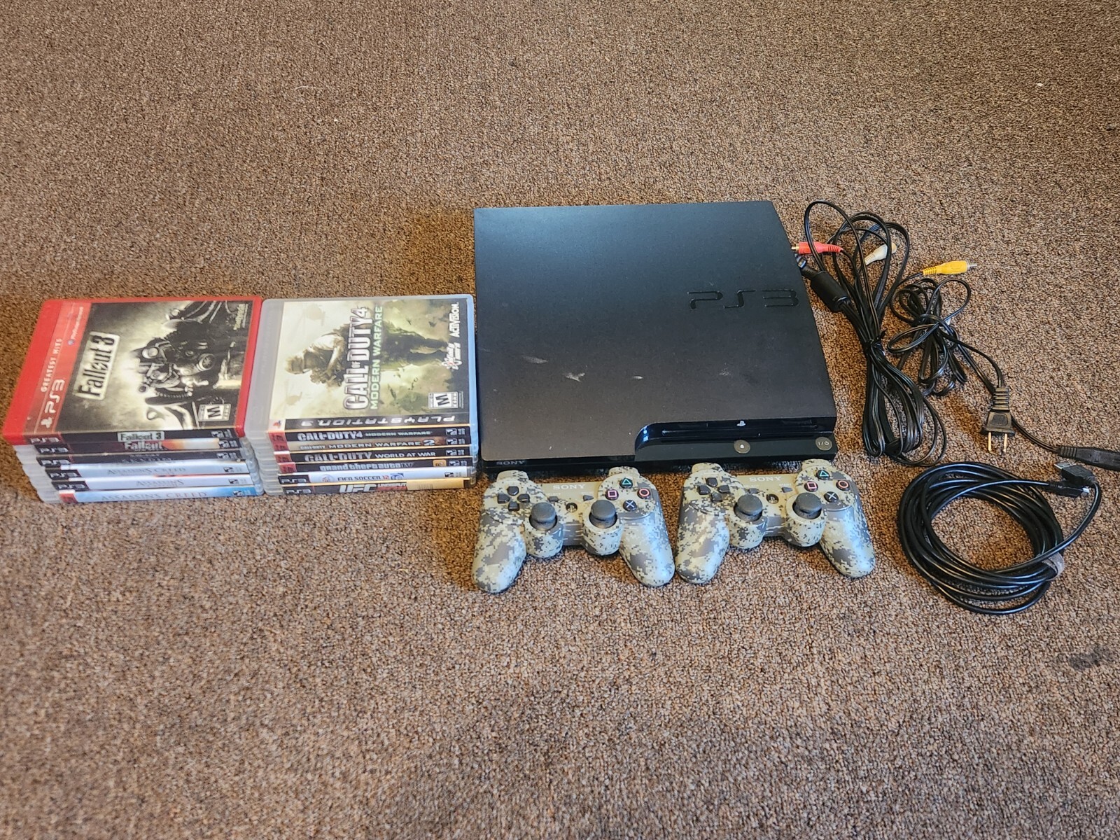 Sony PS3 (CECH-2001A) Bundle (12 games, 2 controllers, 1 Padded Travel Bag)