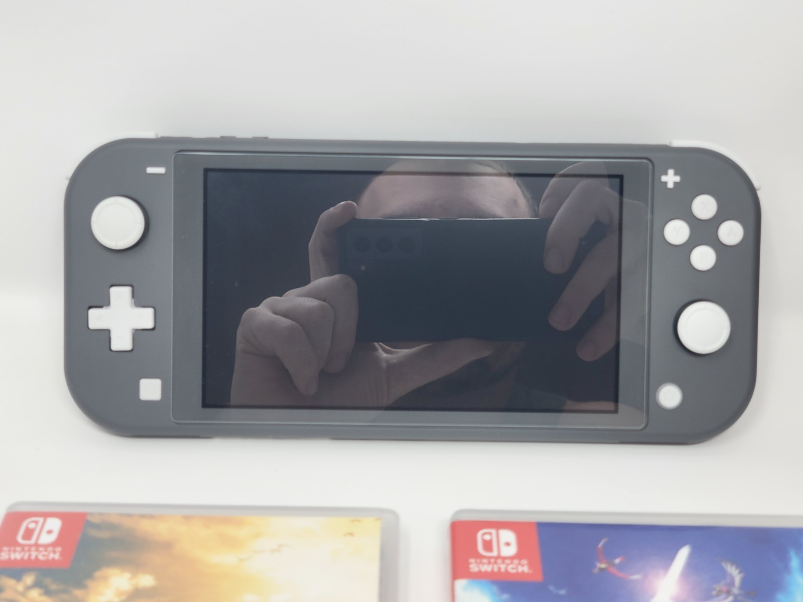 Nintendo Switch Lite Gray Handheld System W/ Case + Zelda BOTW & Skyward Sword