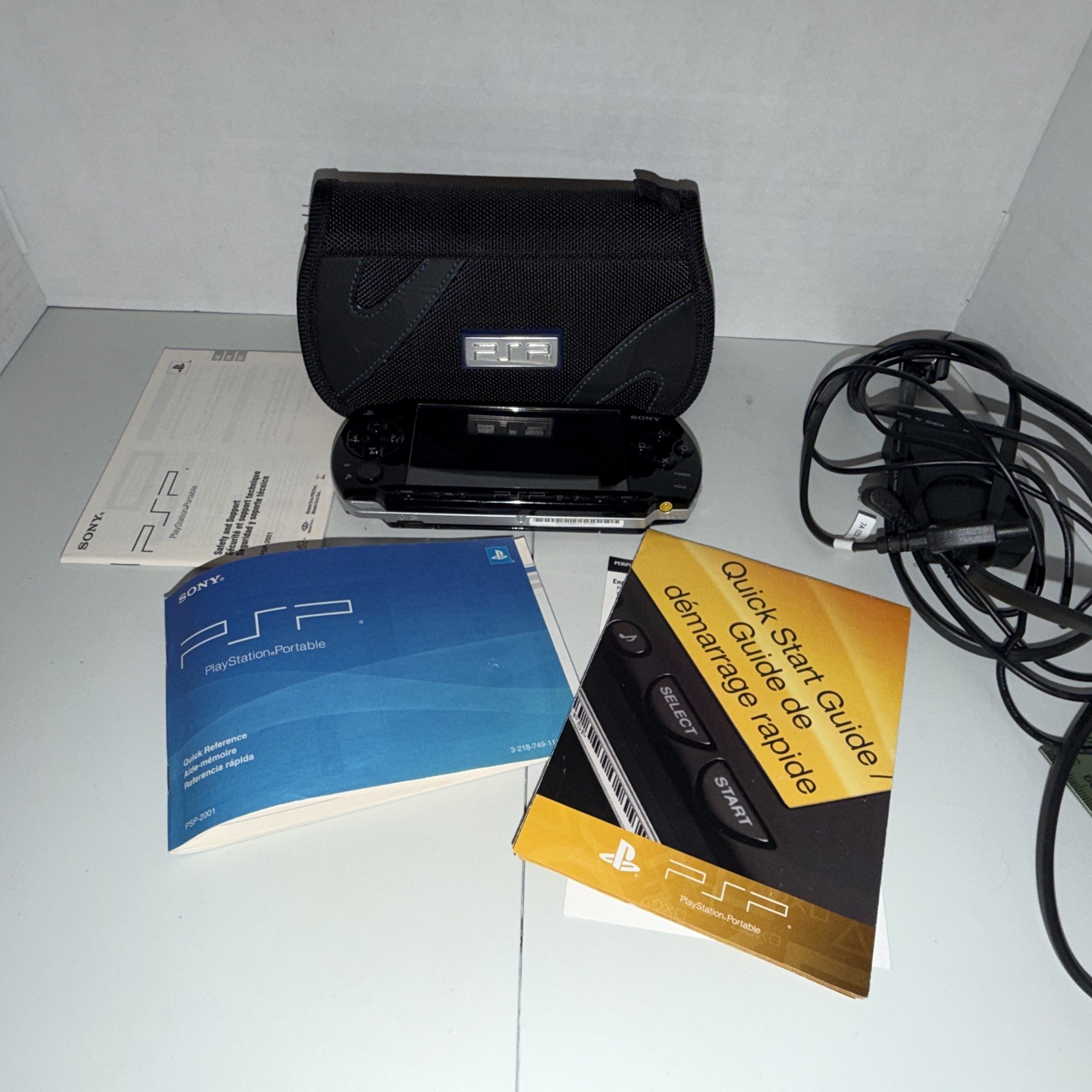 SONY PSP-2001 Black Console Bundle W/ Charger, New Battery, 6 Games – Tested!