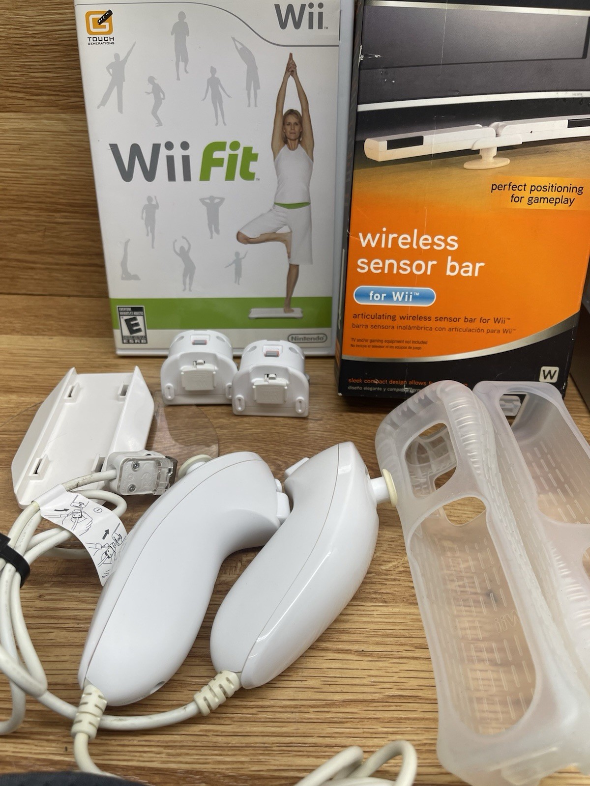 Nintendo Wii Console, Stand, Cords, 2 Controllers, 2 Nunchucks, Manual, 2 Games
