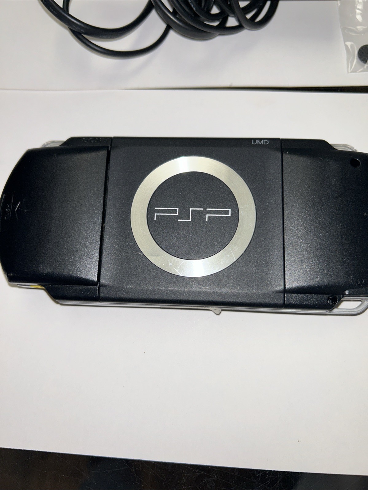 SONY PSP 1000. Works. Cable Plus Extra Joystick Caps.