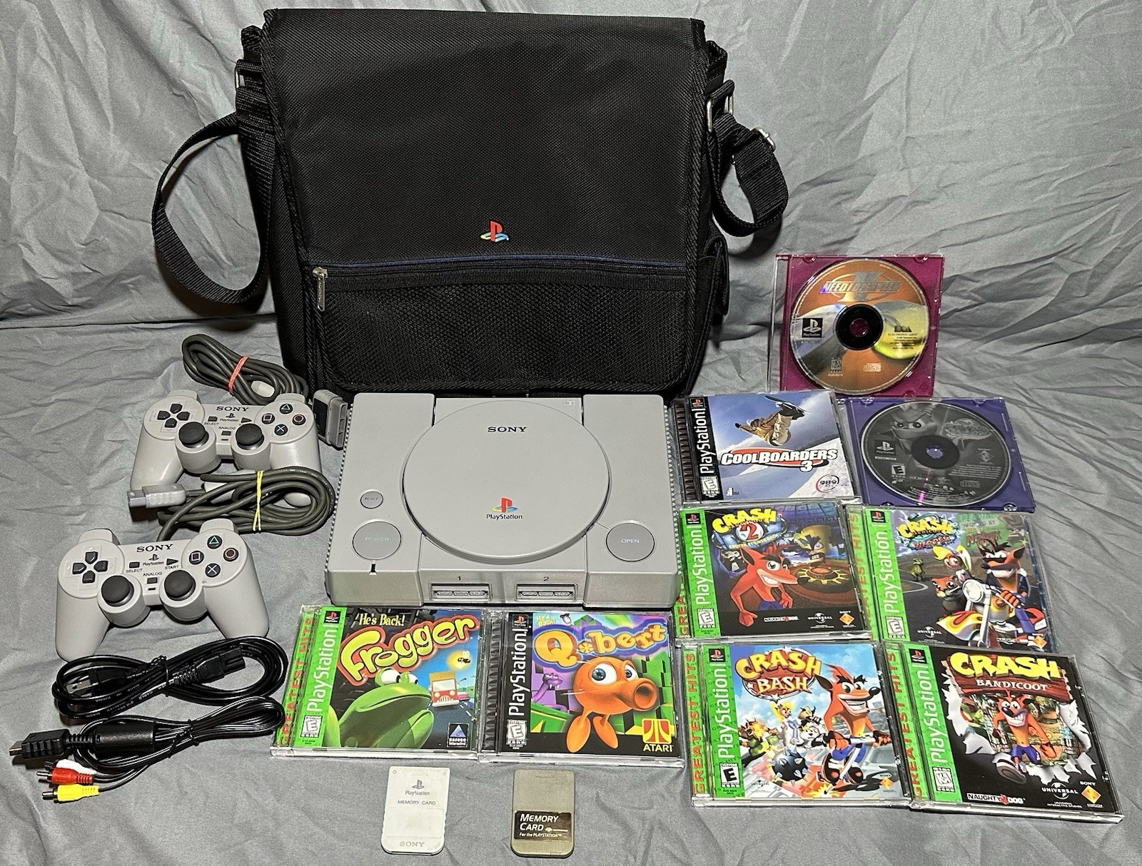 HUGE Sony PlayStation 1 BUNDLE W/OG Travel Bag & GREAT GAMES *TESTED & CLEANED*