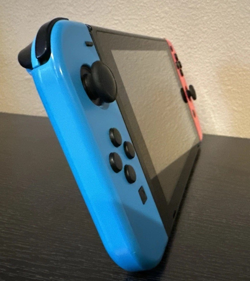Nintendo Switch 32GB Handheld Console – Neon Red/ Blue – w/ Controller & 2 Games