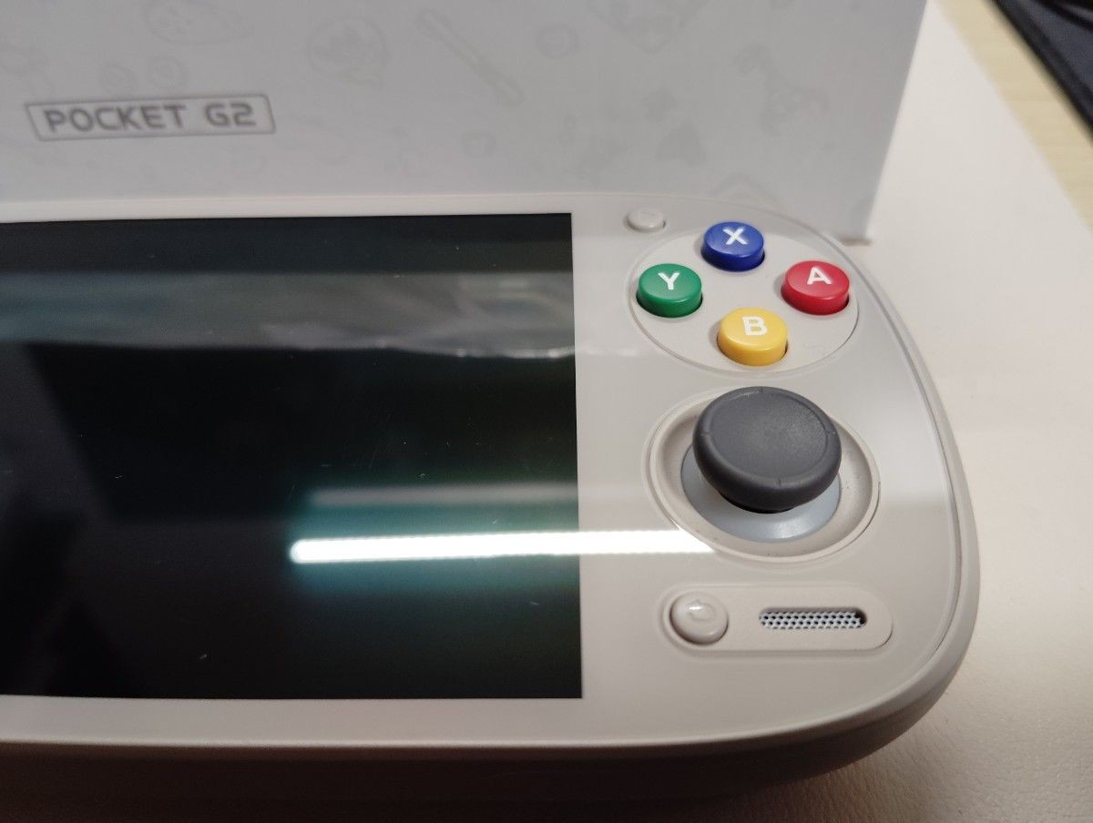 Retroid Pocket G2 handheld game console, 16-bit color, used, TPU case included.