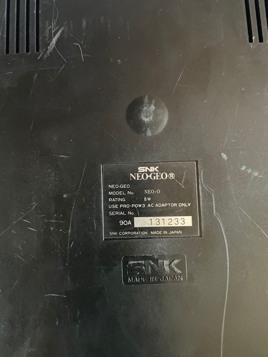 Neo Geo console, 2 controllers, 5 ROM cartridges, and 1 memory card.Tested