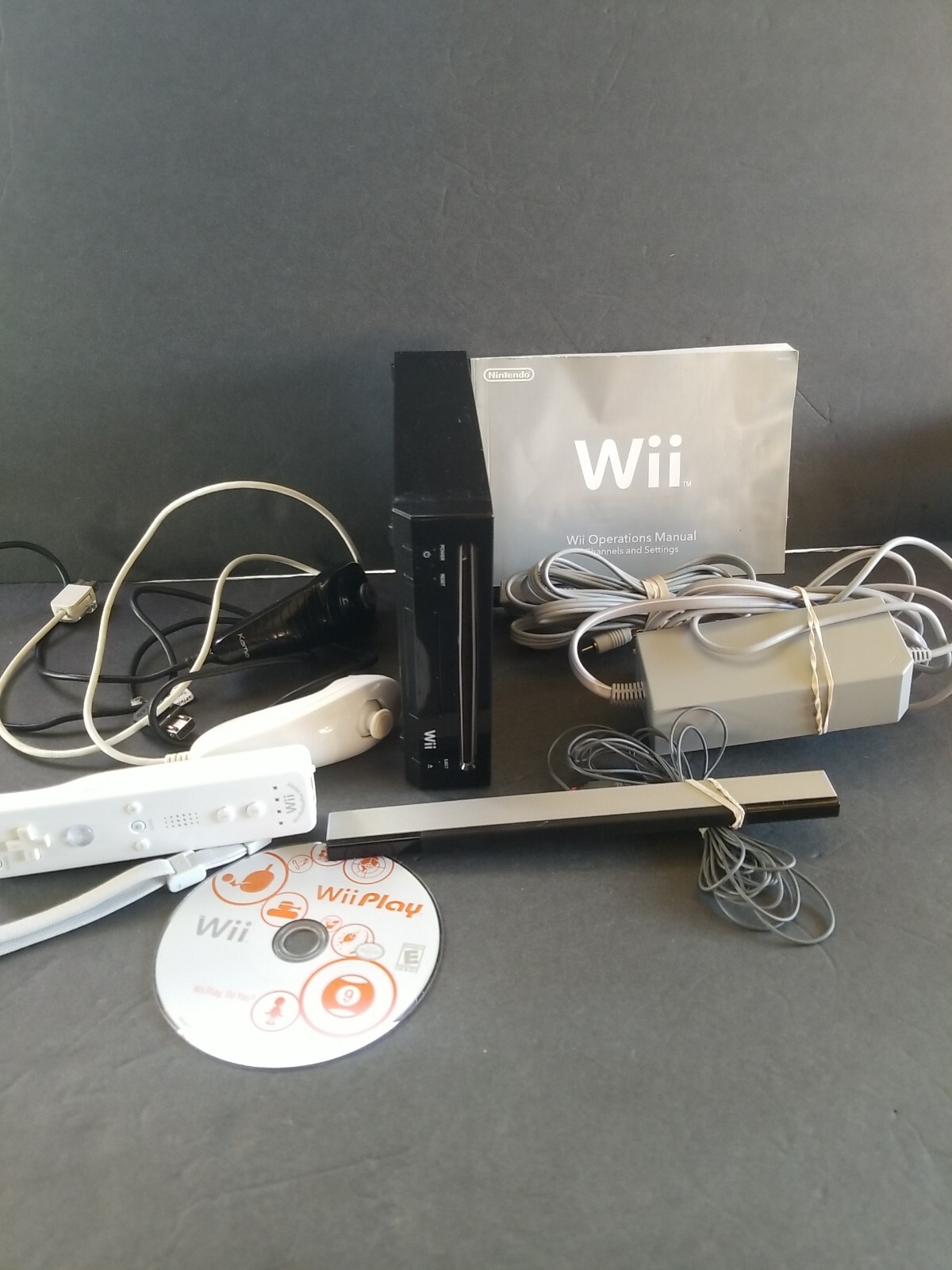 Nintendo Wii RVL-101 Black Console Bundle W/ Wii PlayController & Nunchuck book