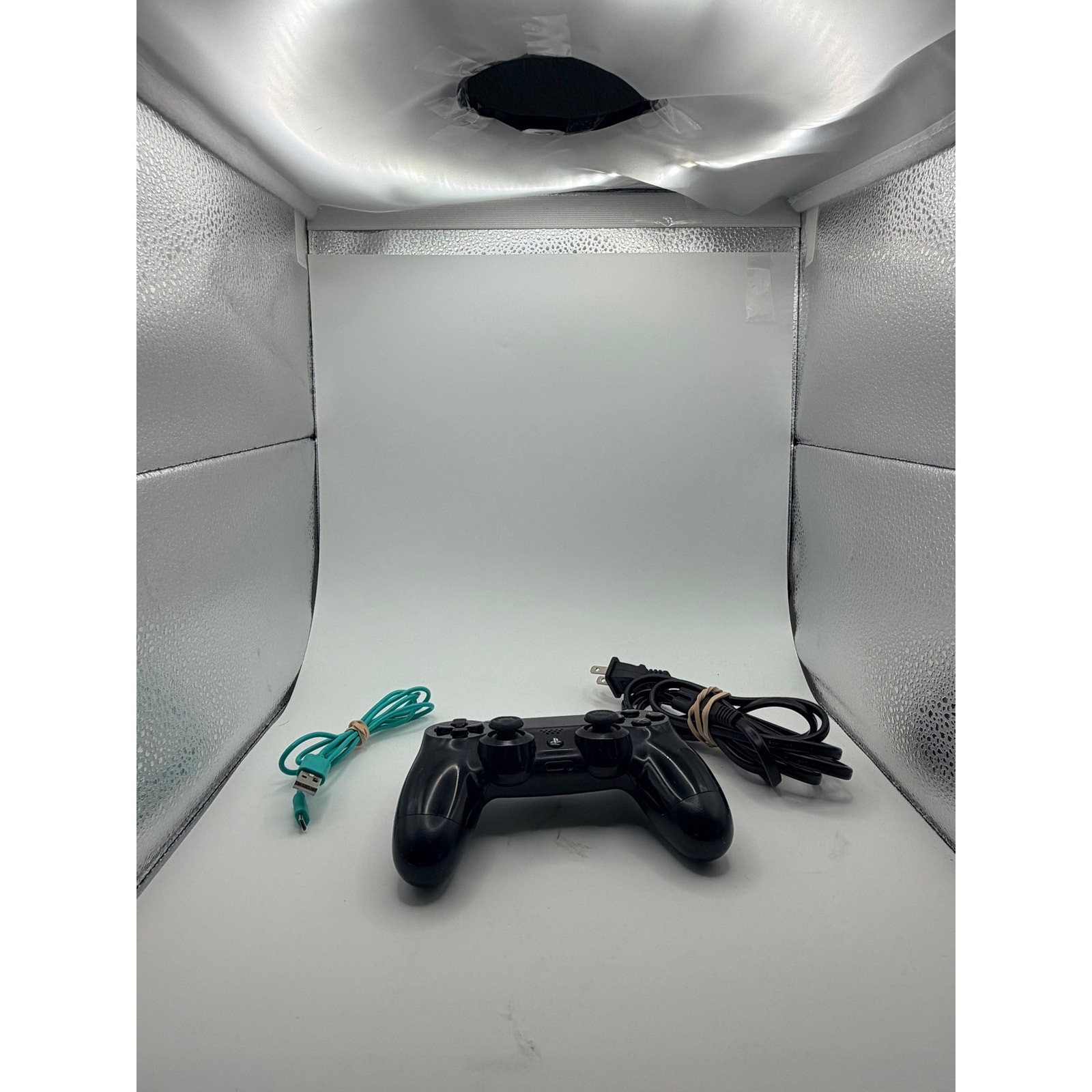Original PlayStation four with controller and charger