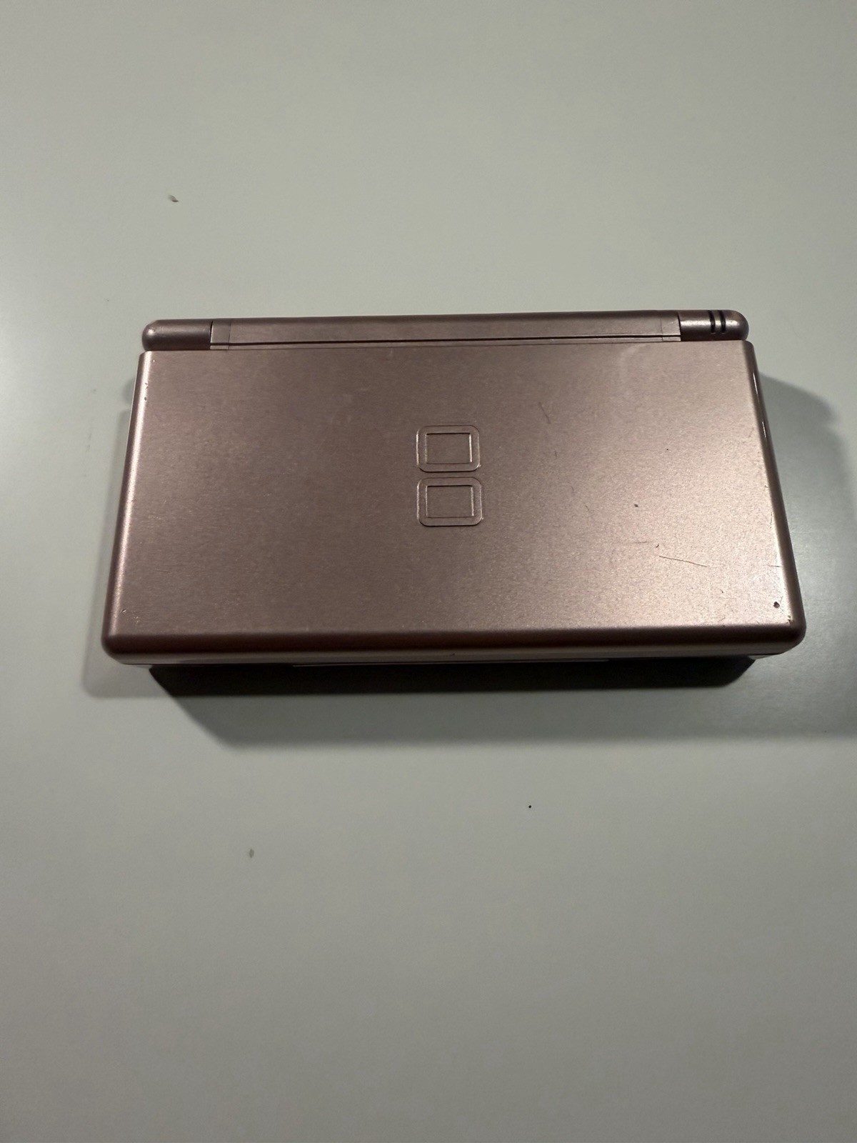 Nintendo DS Lite Metallic Rose System With Charger, Original Box, And 2 Cases