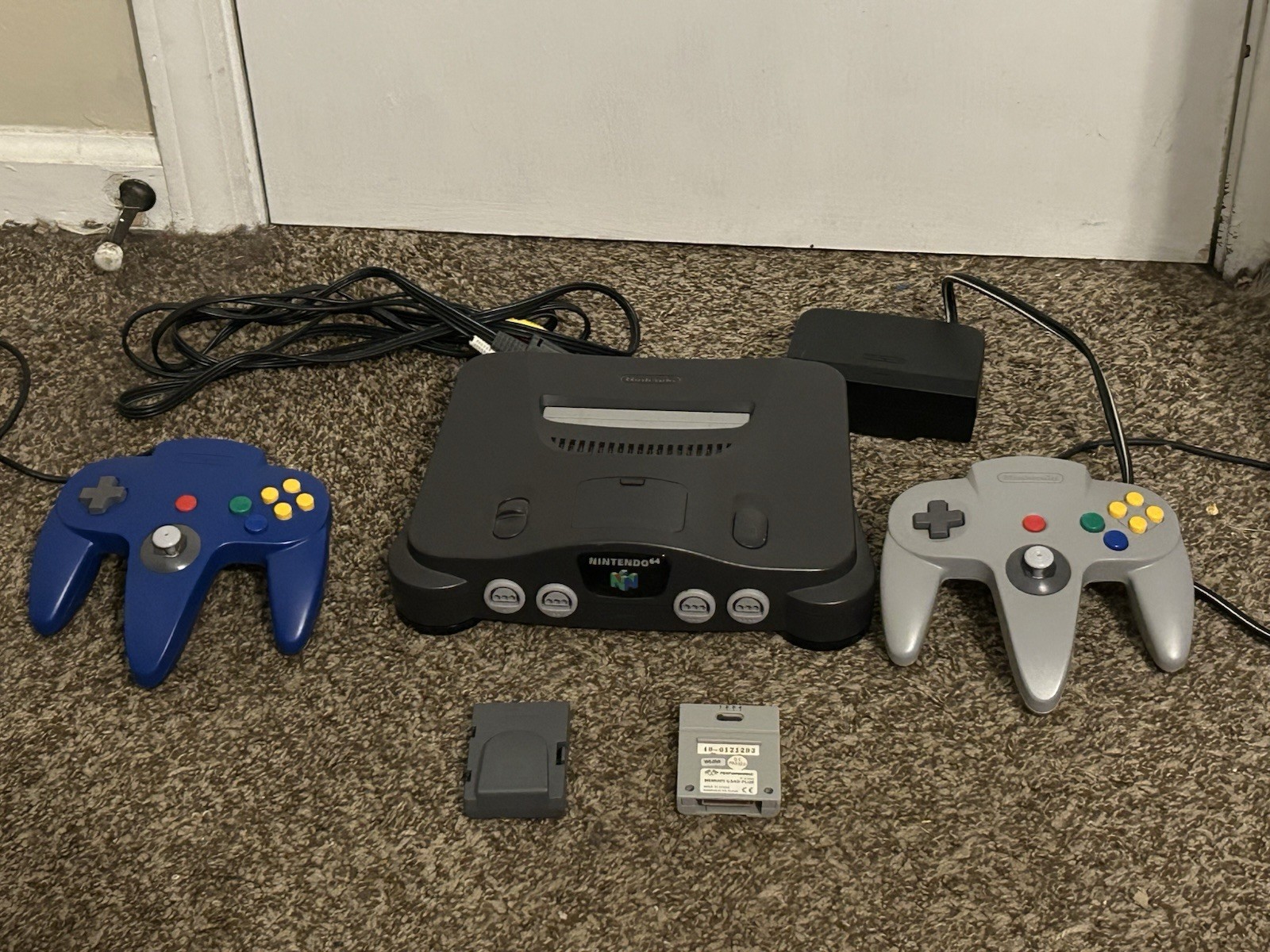 Nintendo 64 bundle – 2 controllers- memory pack – cords – console – port cleaner
