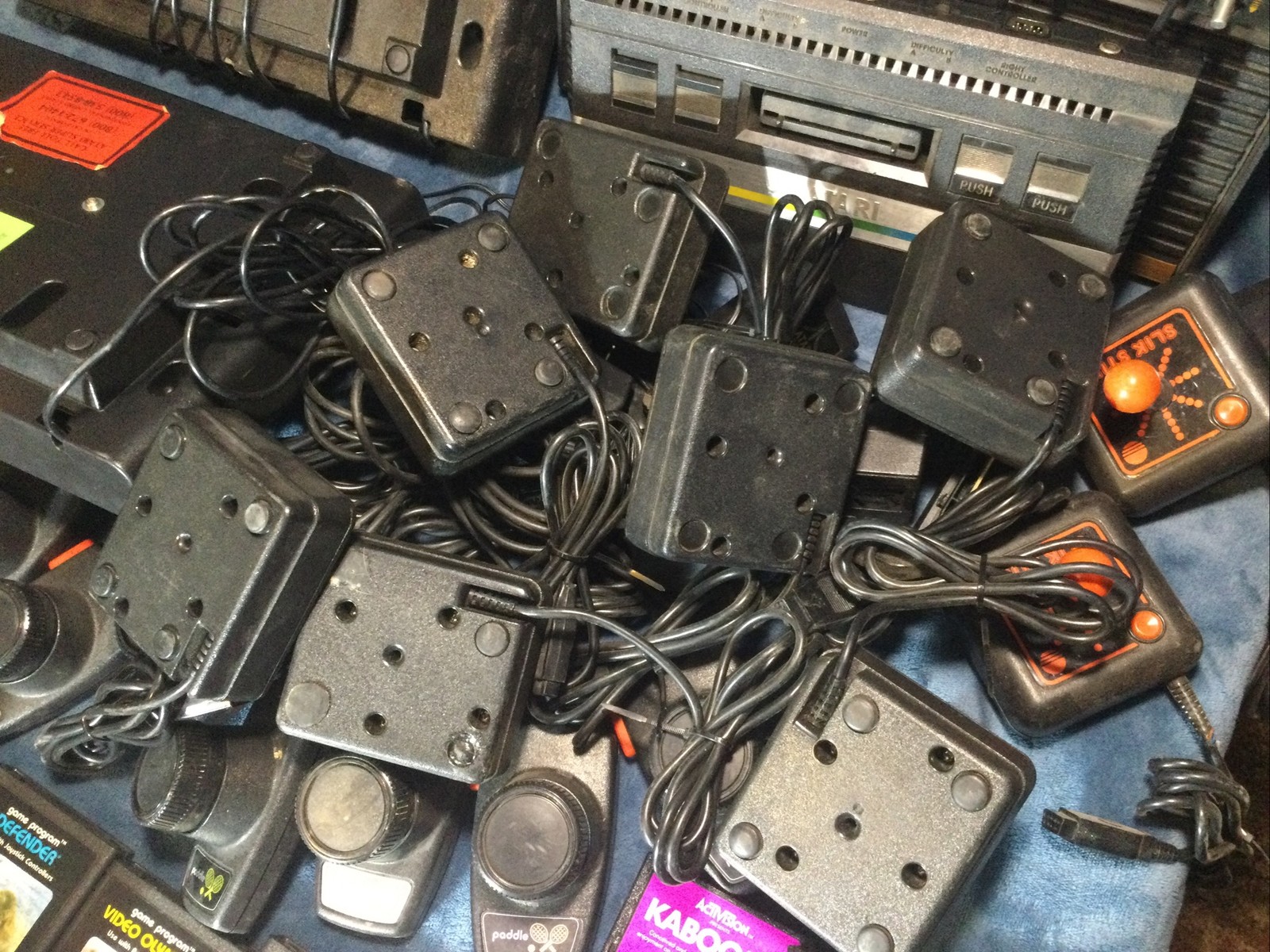 LOT(4) ATARI 2600 CONSOLES (42)GAMES (21)CONTROLLERS (4)AC ADAPTERS UNTESTED!!