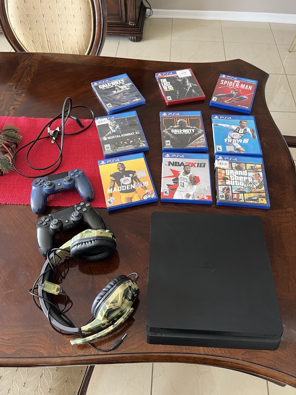PS4 Slim 1TB of storage,9 different games, 2 different controllers and 1 headset
